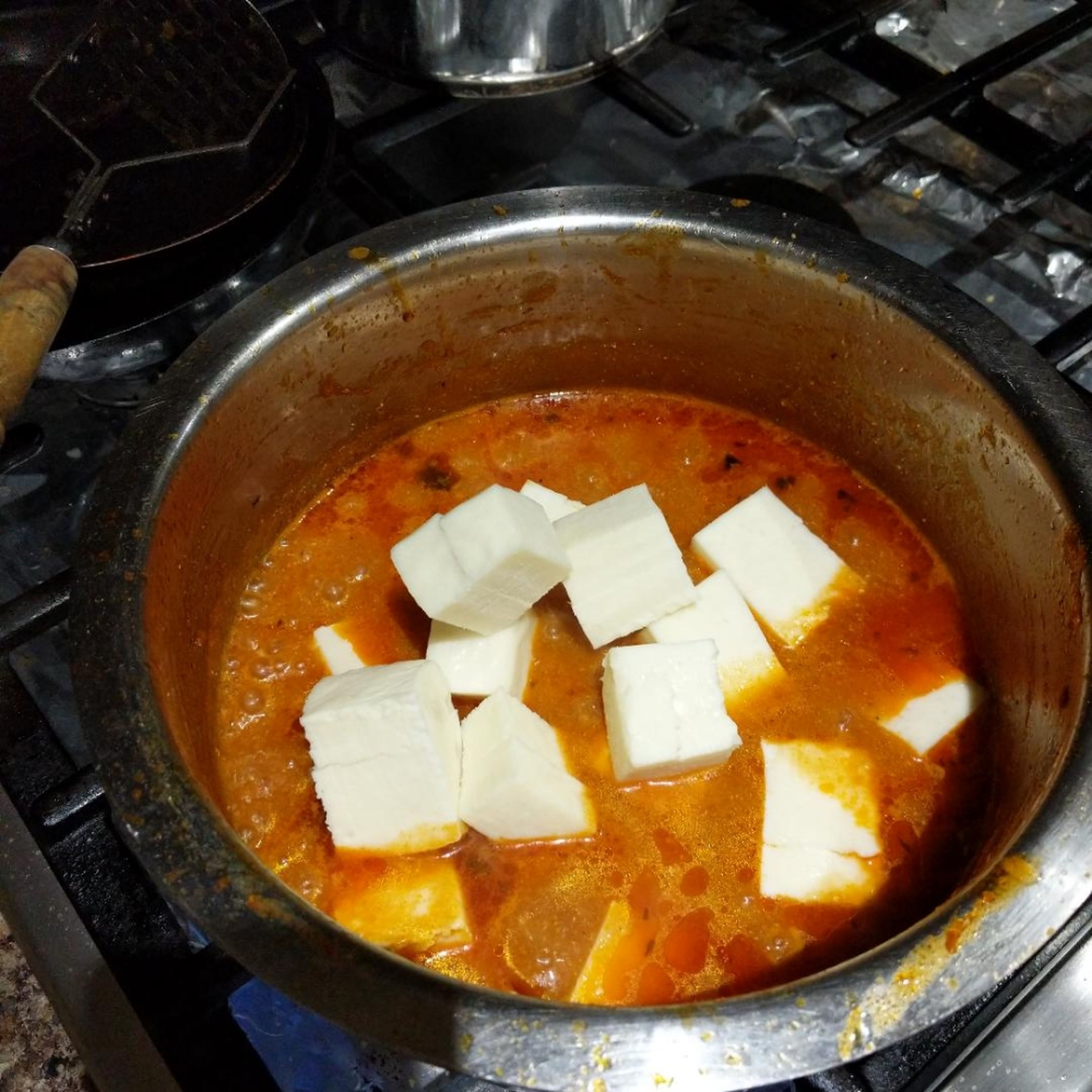 Cut paneer block into cubes and add to curry. Then cover and cook on low/simmer for 10min