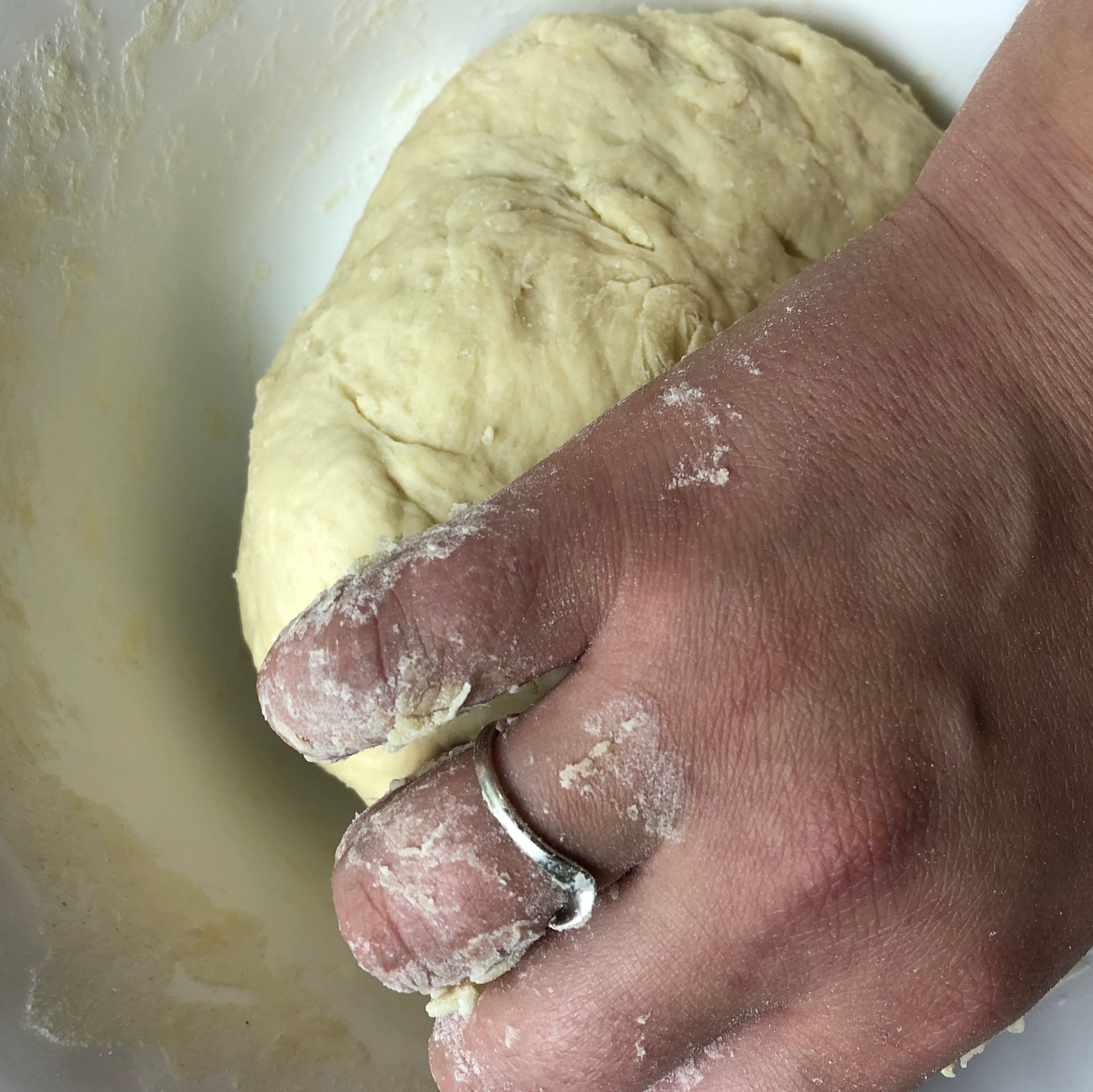 While the meat is being cooked, we start preparing dough for our galnash. In a large bowl, mix flour with egg and water. Knead with hands until a smooth dough forms. Cover with a kitchen towel and set aside for 15-20 minutes.