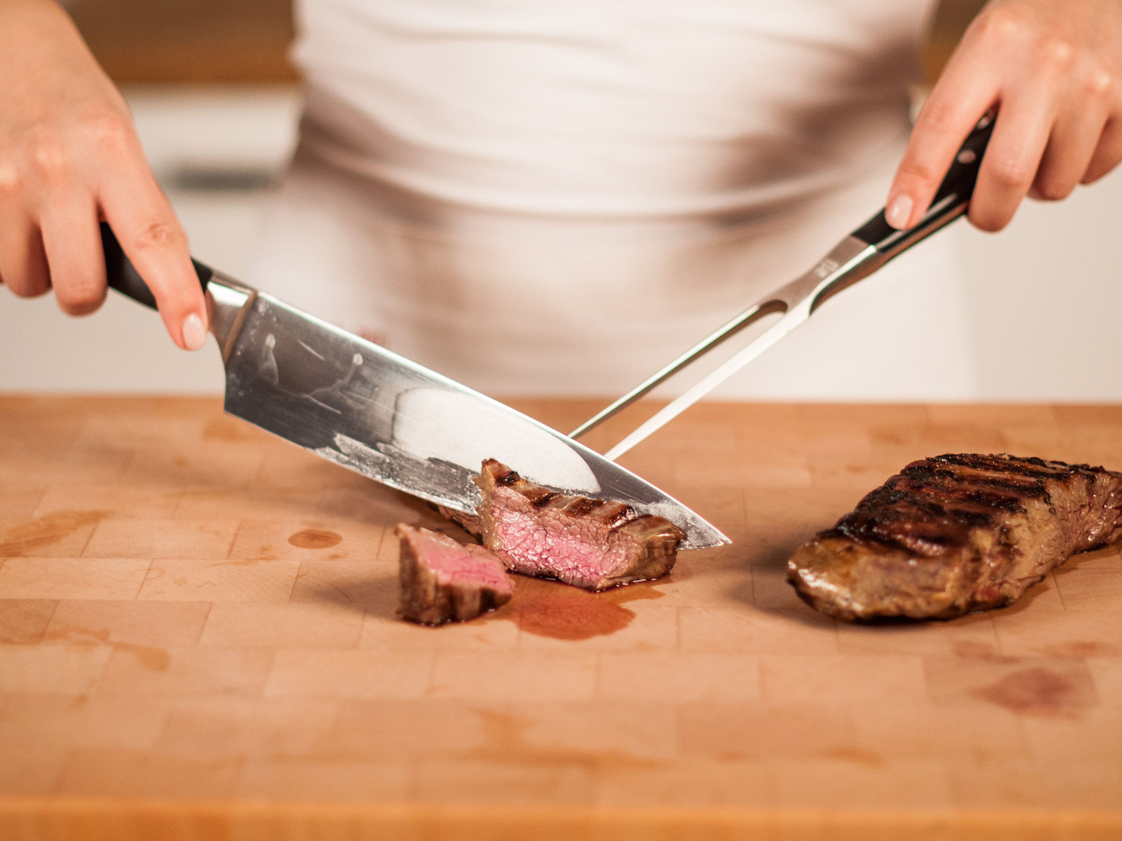 Serve by slicing the steaks into thin slices, always cutting the steaks against the grain of the meat for maximum tenderness.