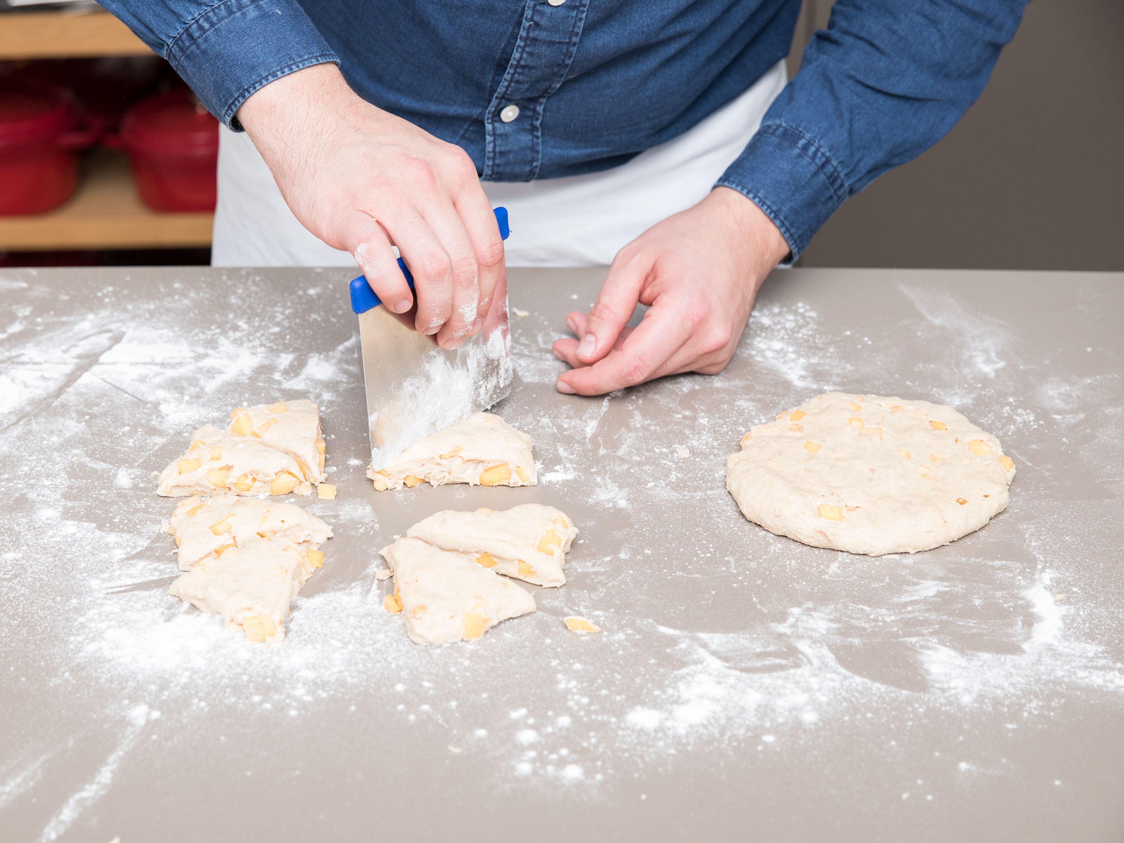 Flour a working surface. Halve the dough and form each half into a round disc. Divide each dough into eight scones and transfer them to a parchment paper-lined baking sheet.