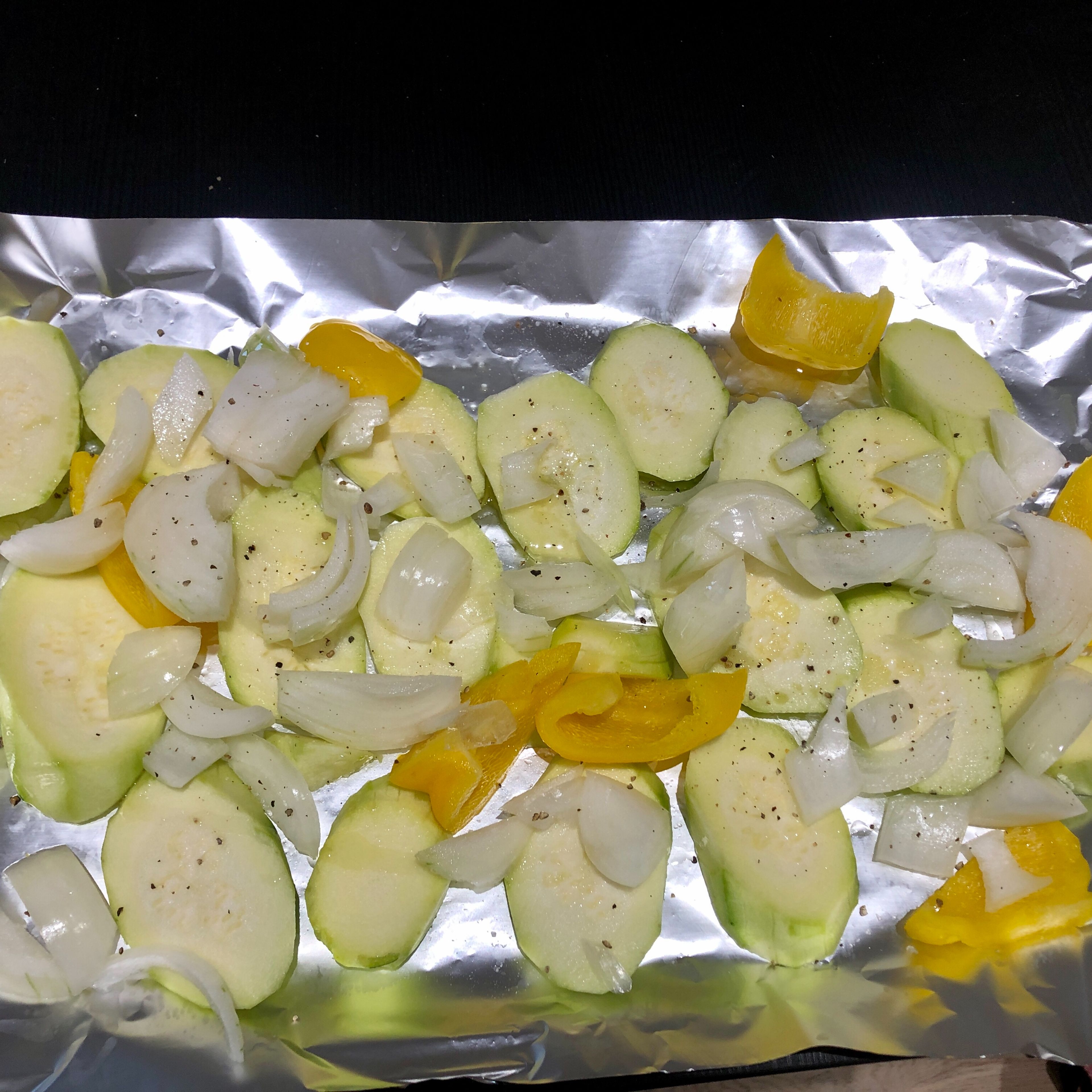 Dice courgette, pepper and onion into slices. Drizzle with olive oil and sea salt