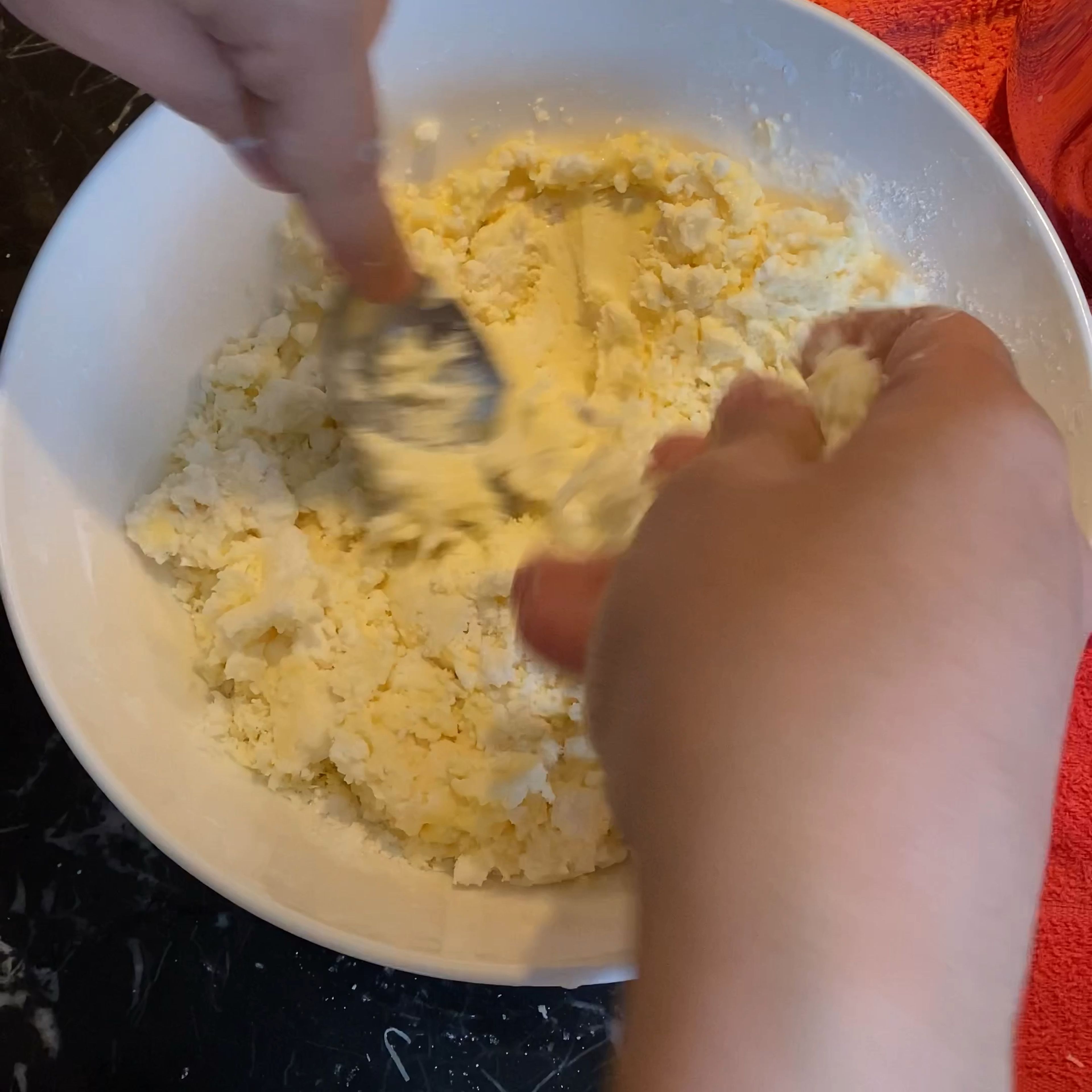 Keep pressing and gradually add the cheese.