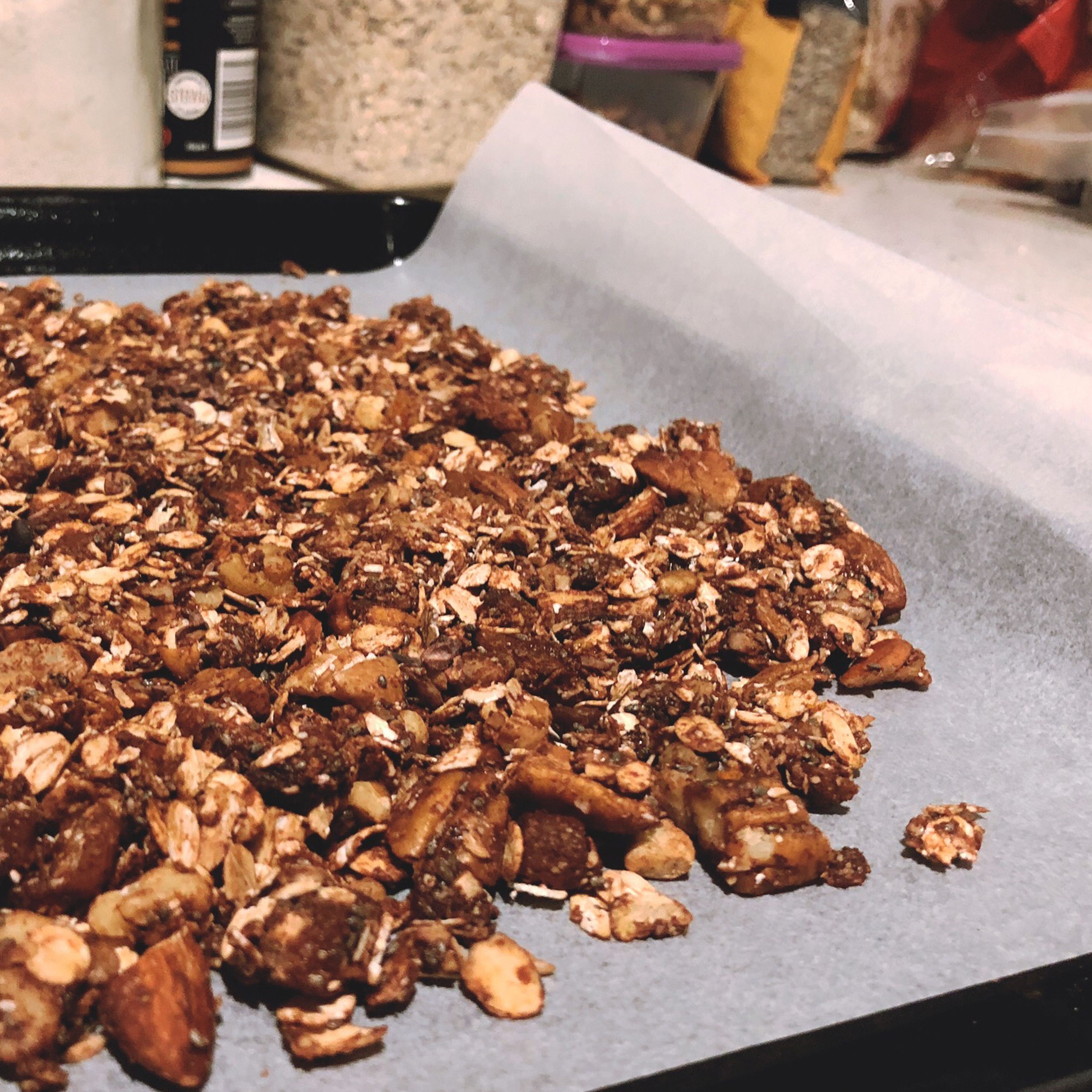 Spread mixture evenly on to the parchment paper and sprinkle some cacao nibs. Bake it in the preheated over at 150 C for approximately 15 minutes.