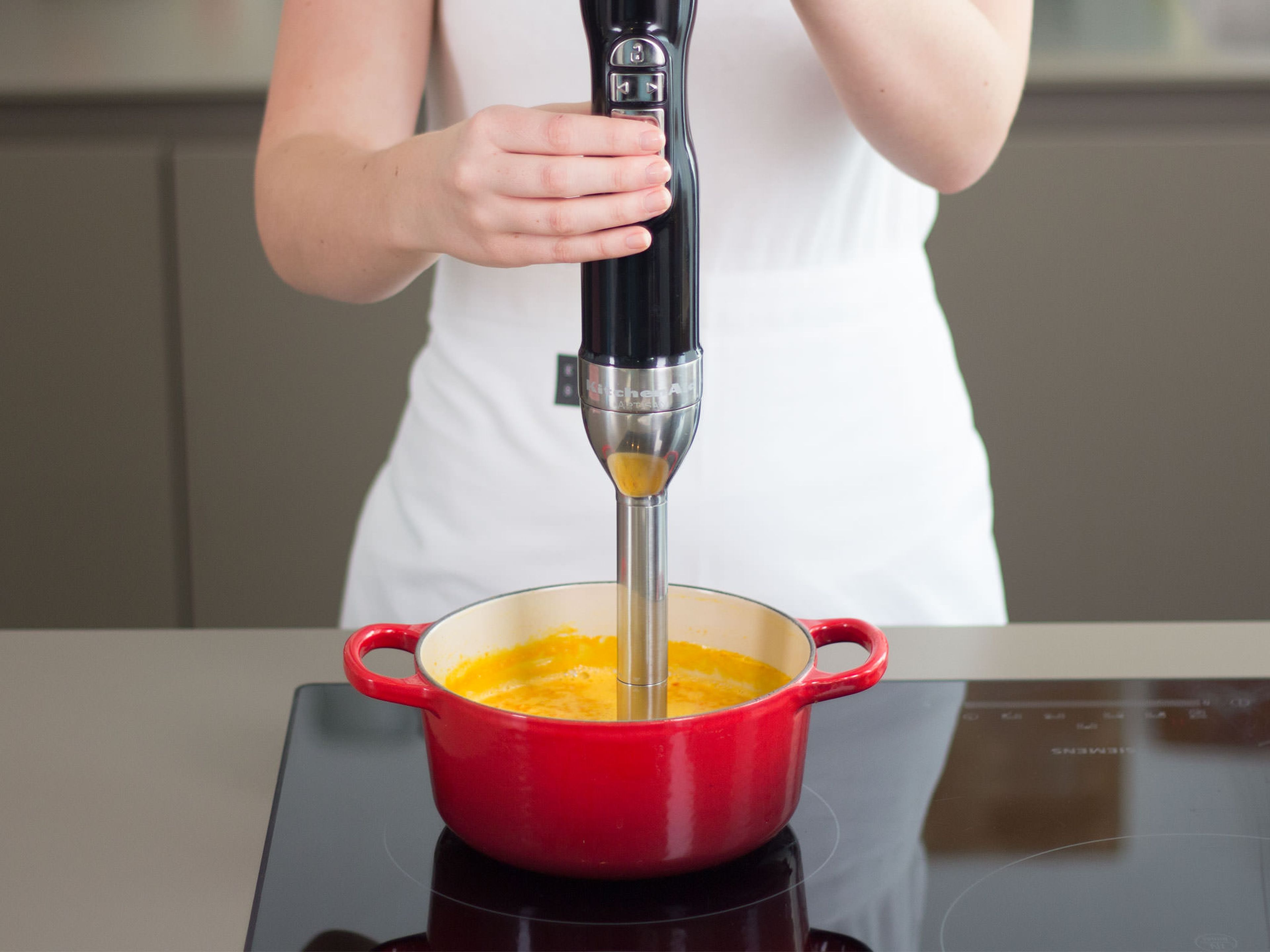 Using a hand blender, puree sauce until smooth.