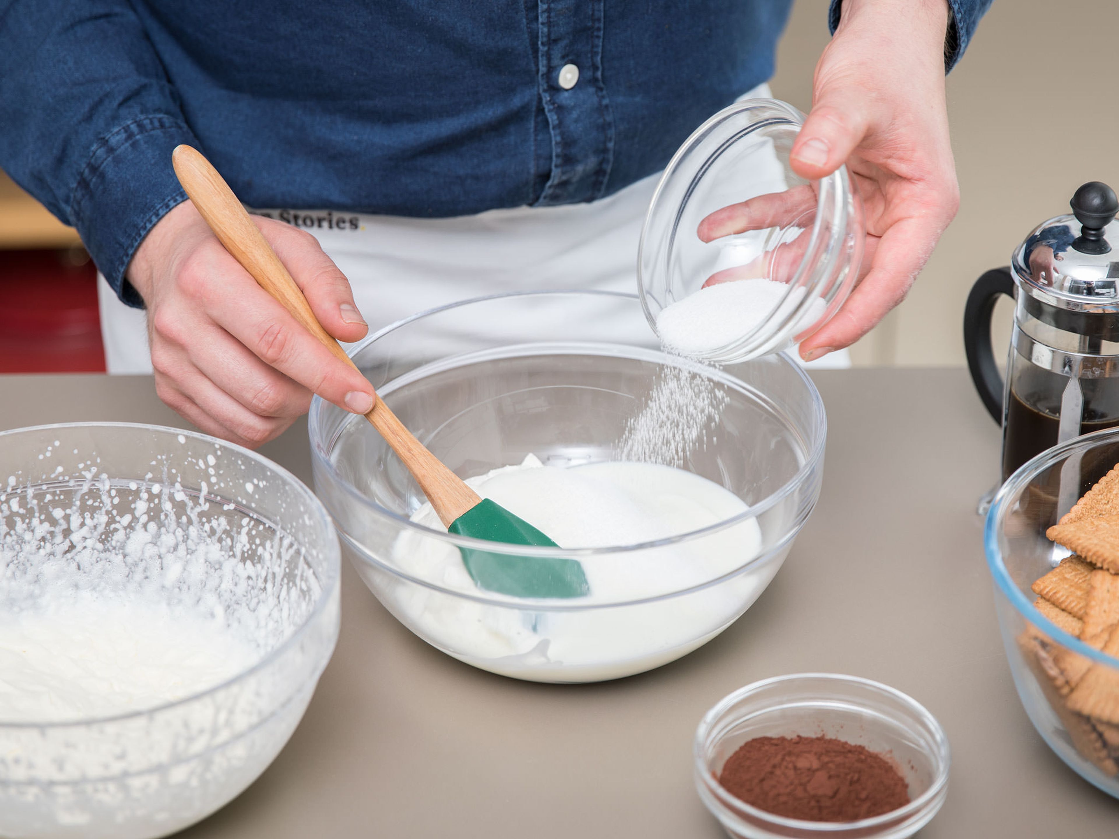 Make a pot of strong coffee and set aside to cool. Whip heavy cream in a bowl until stiff, then chill in the refrigerator. Now beat together the quark, yogurt, sugar, and vanilla sugar until the sugar has dissolved. Taste as you go and adjust sugar volume to preference.