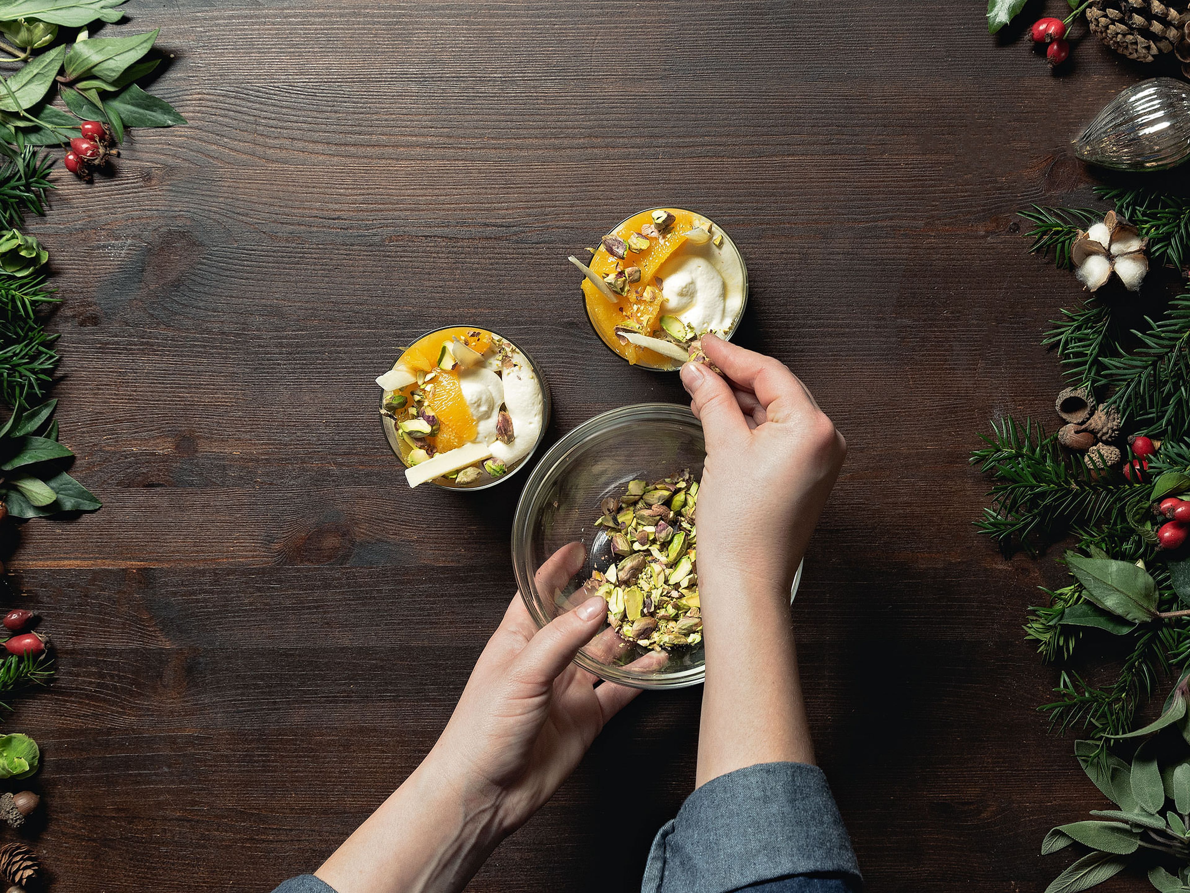 Layer yogurt-white chocolate cream, oranges, and chopped pistachios in serving glasses. Garnish with white chocolate shavings and enjoy!