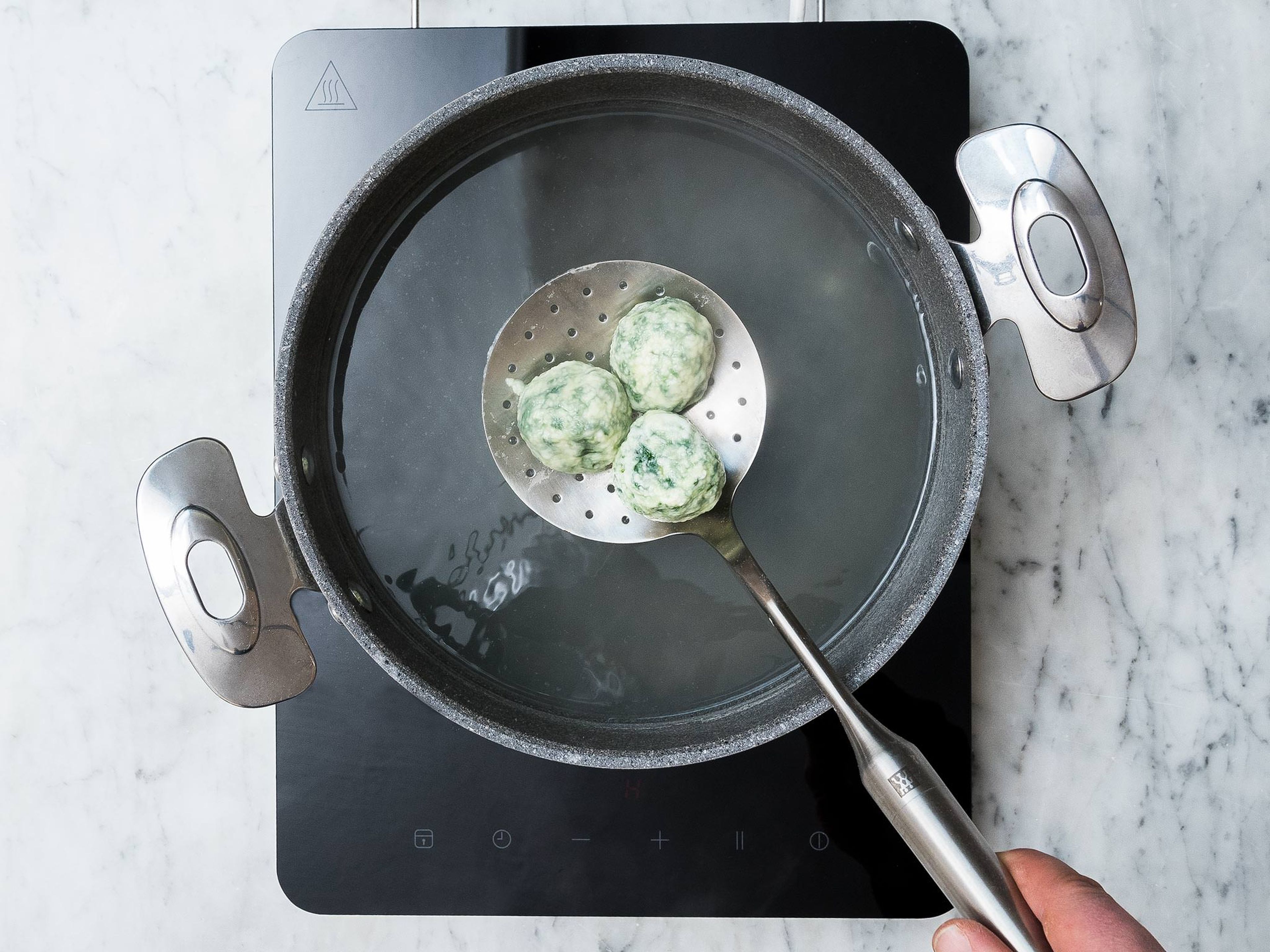 Prepare a large pot of generously salted water and bring to a simmer. Carefully drop the gnudi into the water and cook for approx. 4 - 5 min. or until they begin to float to the surface. Reserve some of the gnudi cooking water.
