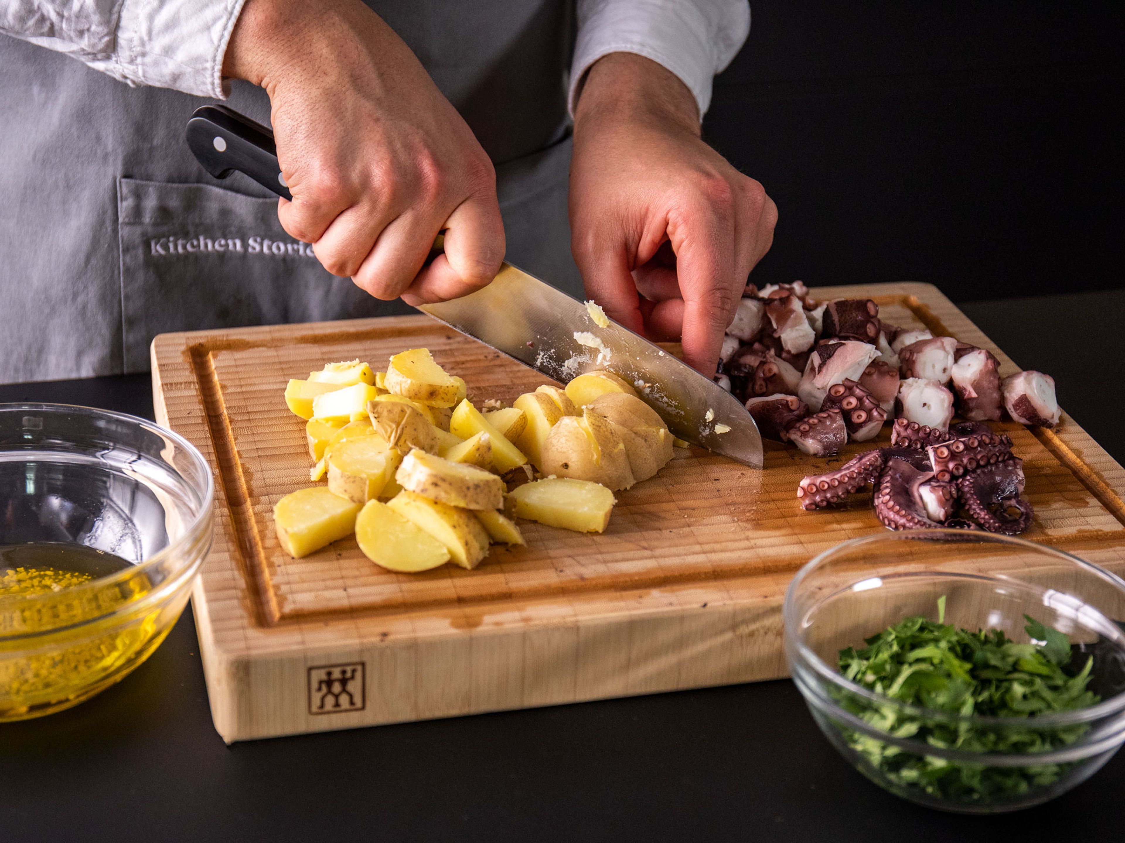 Remove octopus from pot and drain. Cut octopus and potatoes into bite-sized pieces and mix both immediately with the dressing in a large bowl. Season with salt and pepper and serve warm. Enjoy!
