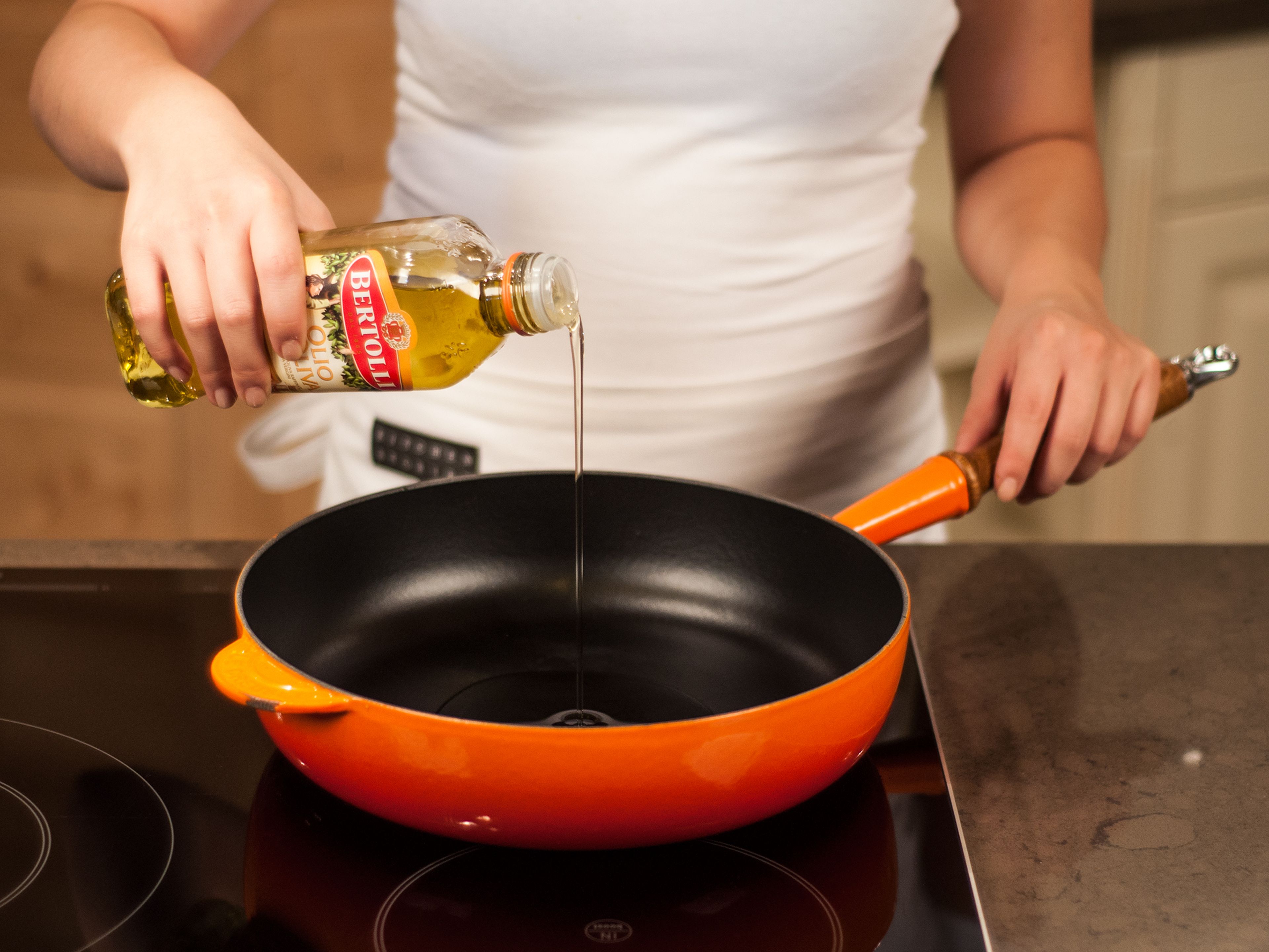 Add a generous amount oil to frying pan and heat over medium-high heat.