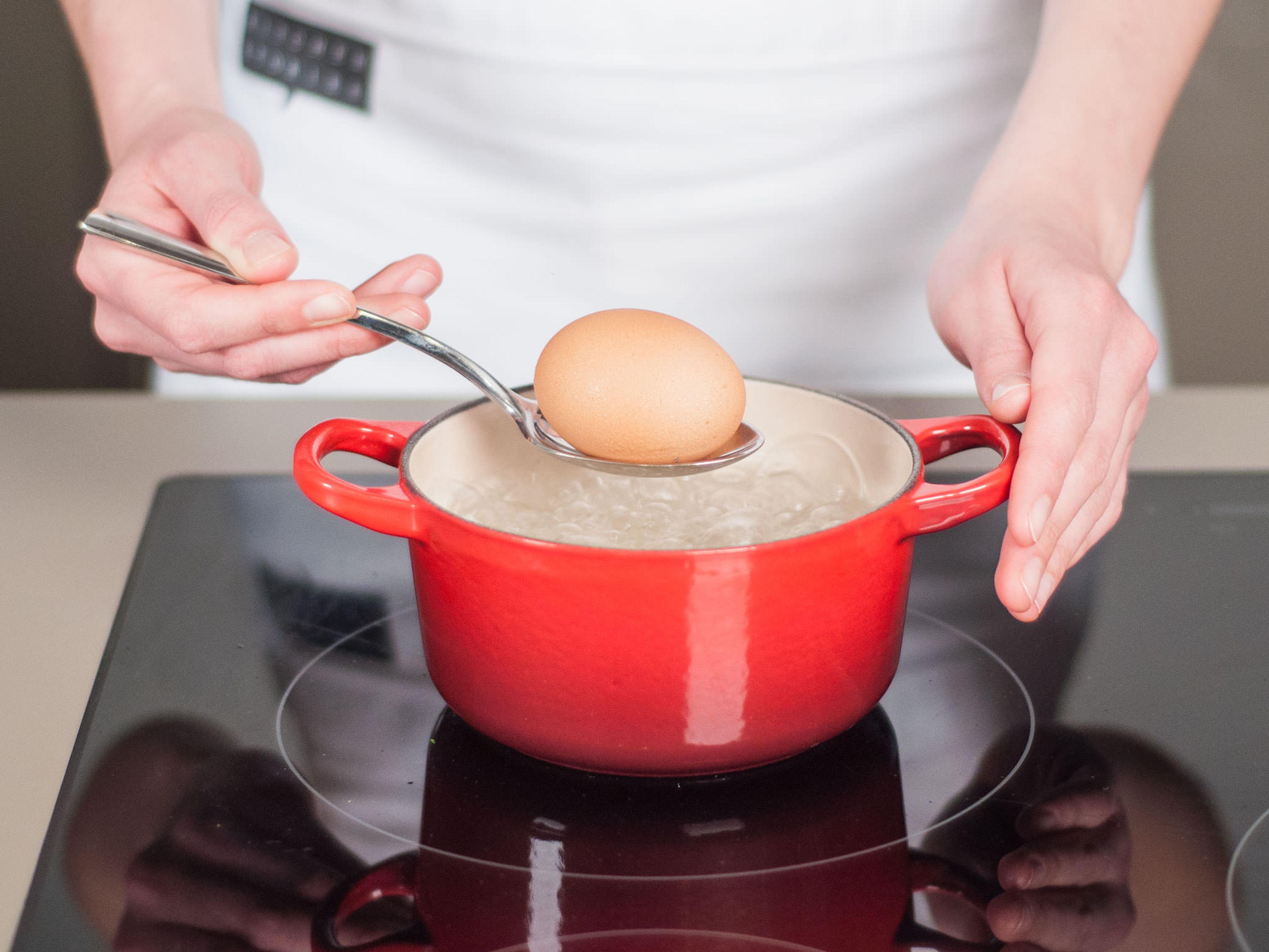 Add water to saucepan and bring to a boil. Cook egg in boiling water until hard boiled, approx. 8 – 10 min. Then remove from water, hold under cold water, peel, and dice. Set aside.