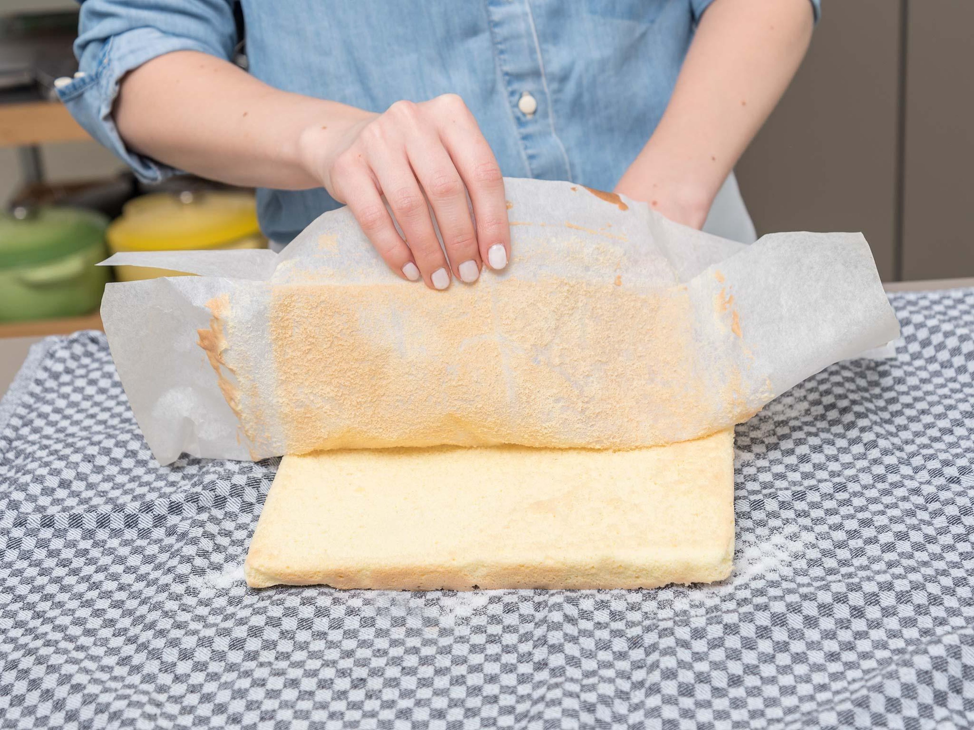 Spread a clean kitchen towel over work surface and sprinkle evenly with sugar. Remove sponge cake from baking pan, turn out onto kitchen towel and peel off parchment paper. Set aside to cool completely.