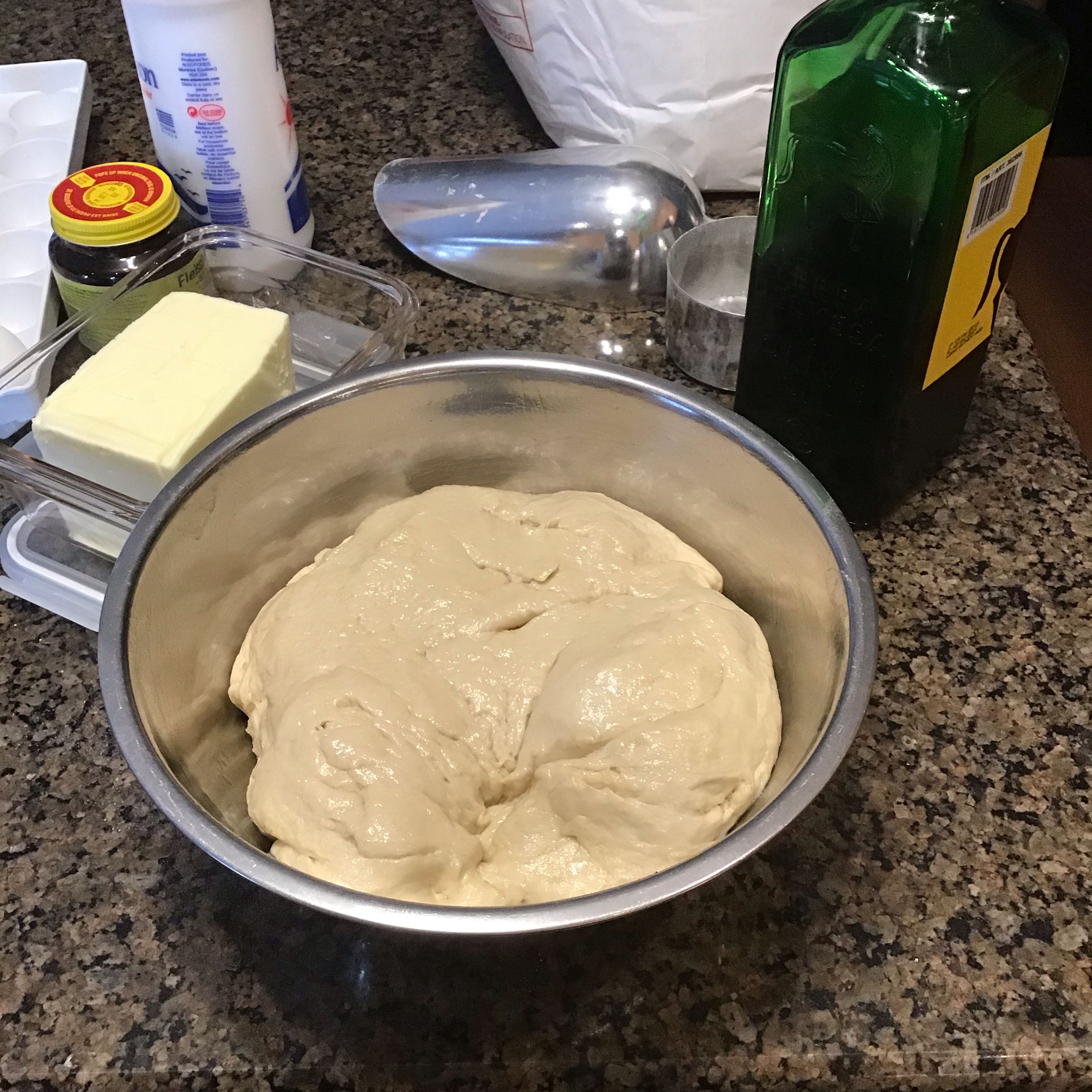 Use oil to grease the inside of a bowl. Transfer ball of dough to the oiled bowl. Turn dough in bowl to coat surface of dough with oil. Cover loosely with a clean kitchen towel or cling film and place in a warm spot to rise until doubled in size. May take 40 to 60 minutes depending on temperature.