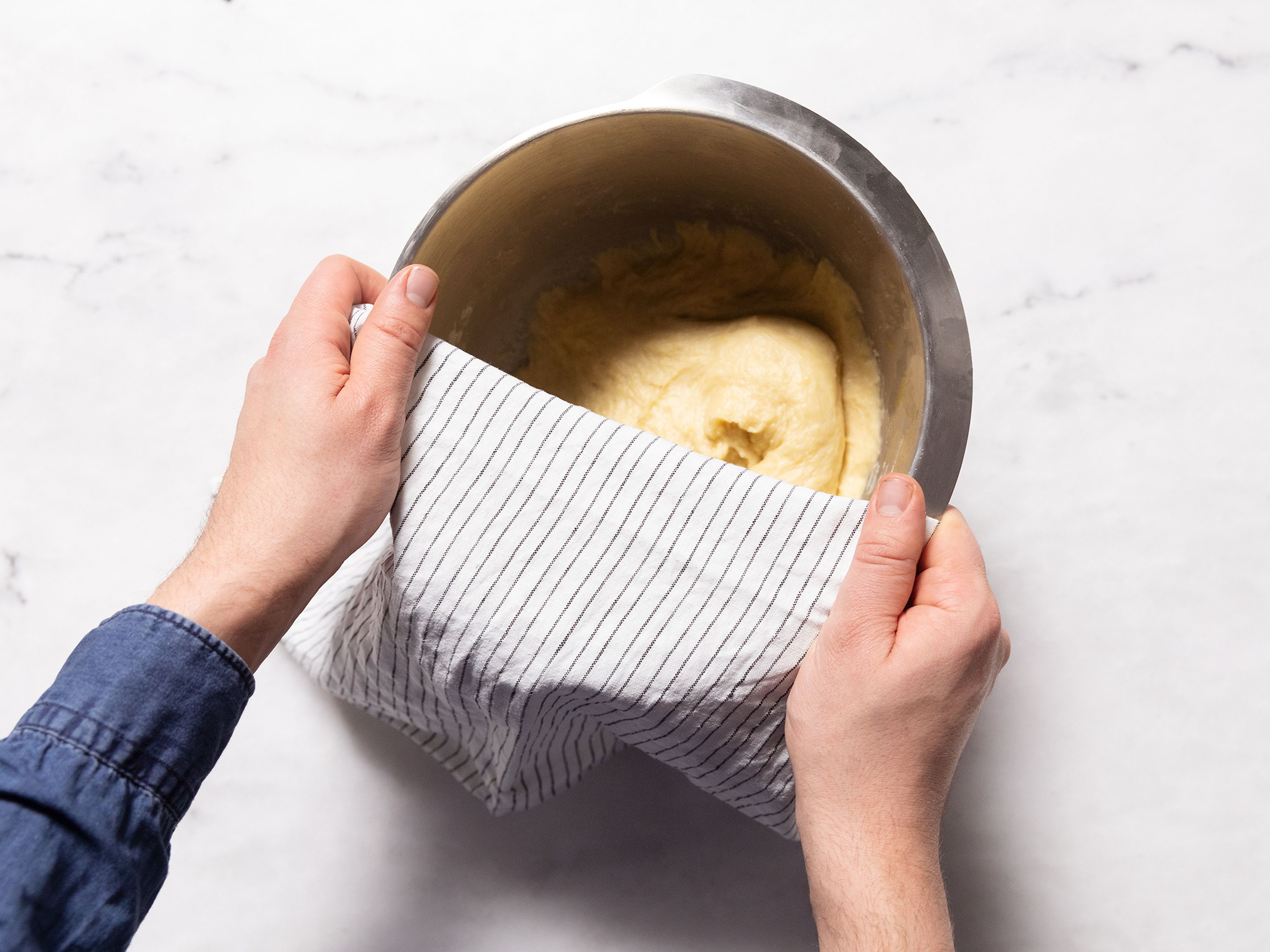 Knead until the dough feels stretchy, cover with kitchen towel and let rise approx. 90 min. in a warm place.