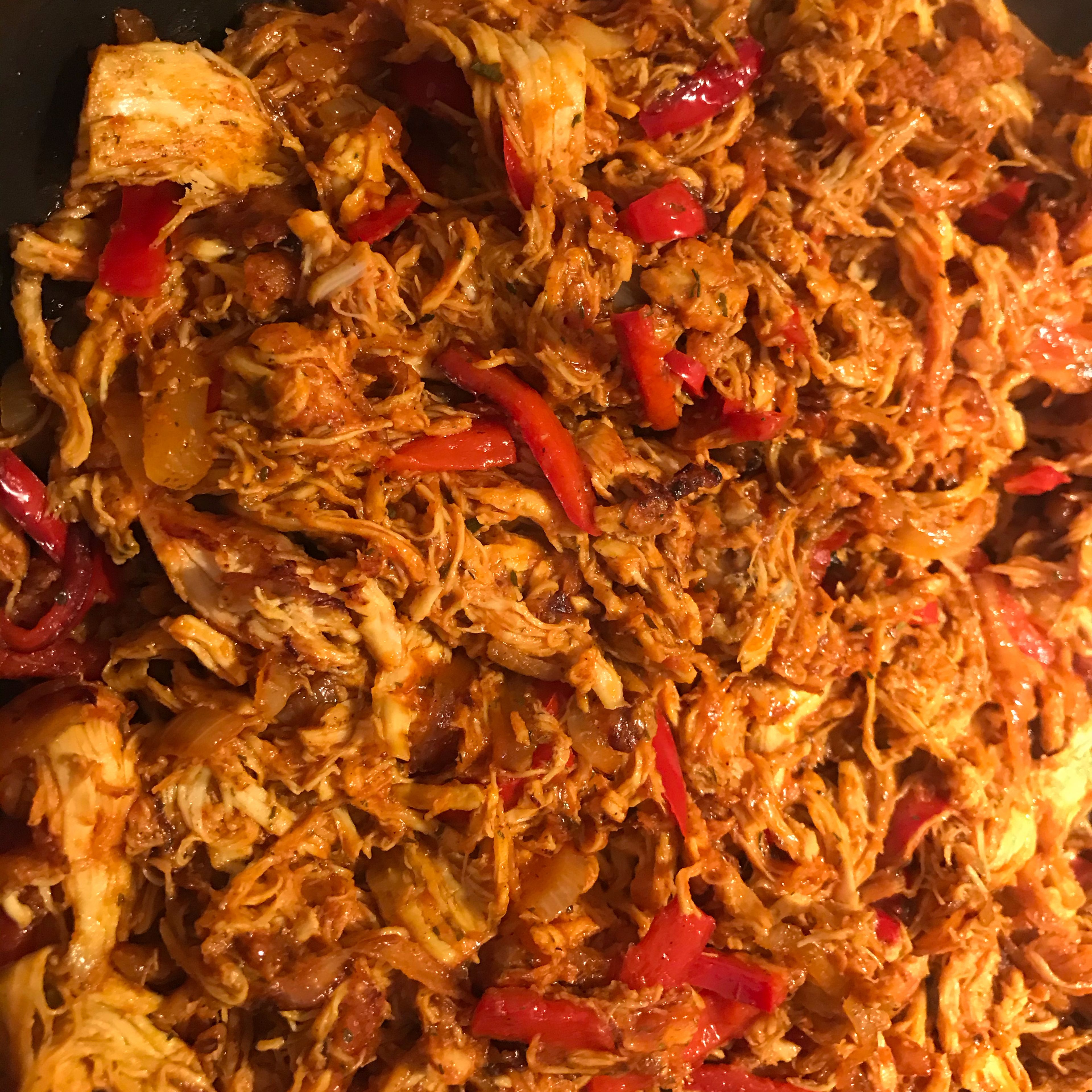 Heat oil in frying pan, add onions and fry for 4 min. After add red pepper and fry for 3 min, then add pulled chicken and fry for 3 min more. Add ketchup, salt and pepper, chilli powder and fry for 4 min and off the heat.