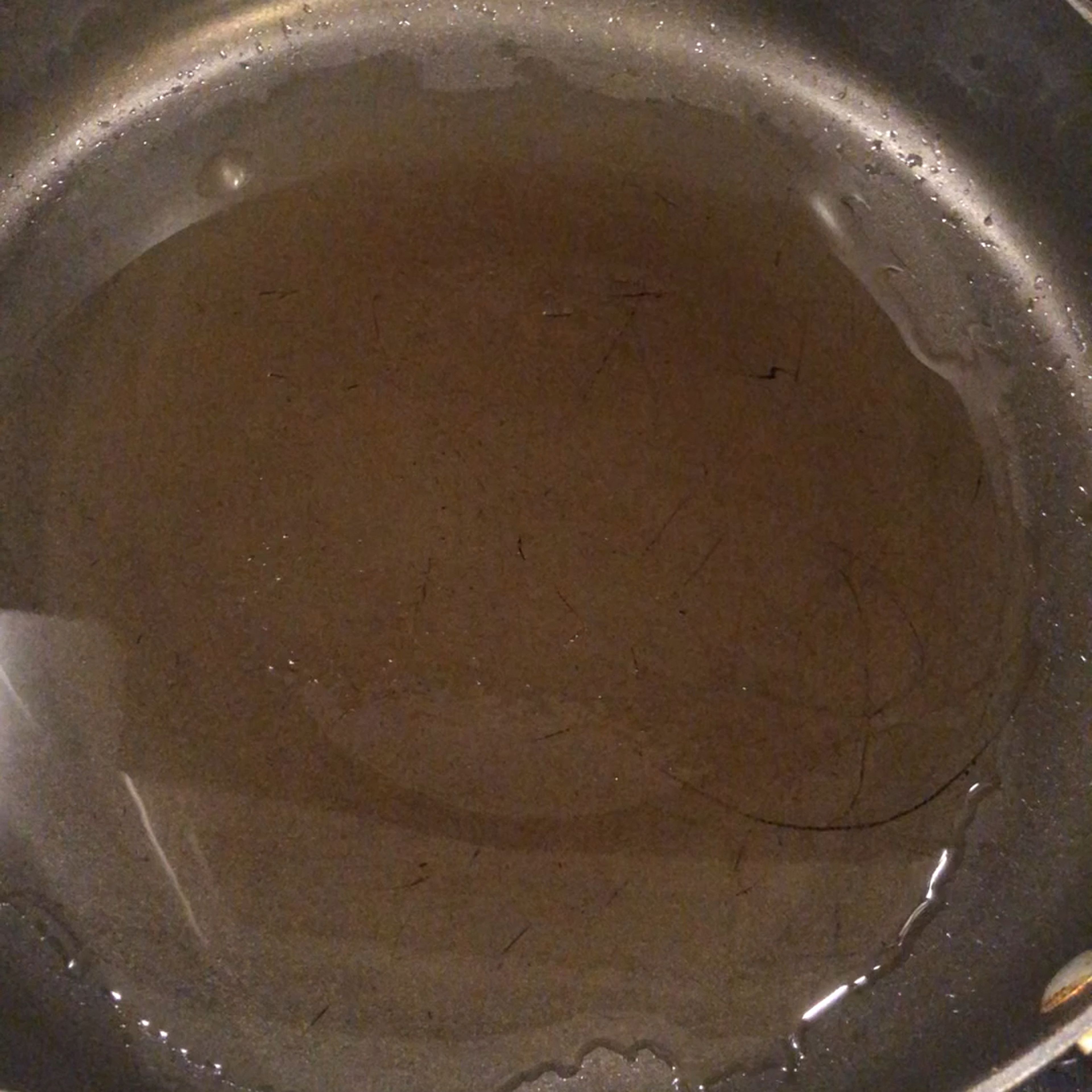 Pour oil on the heated pan