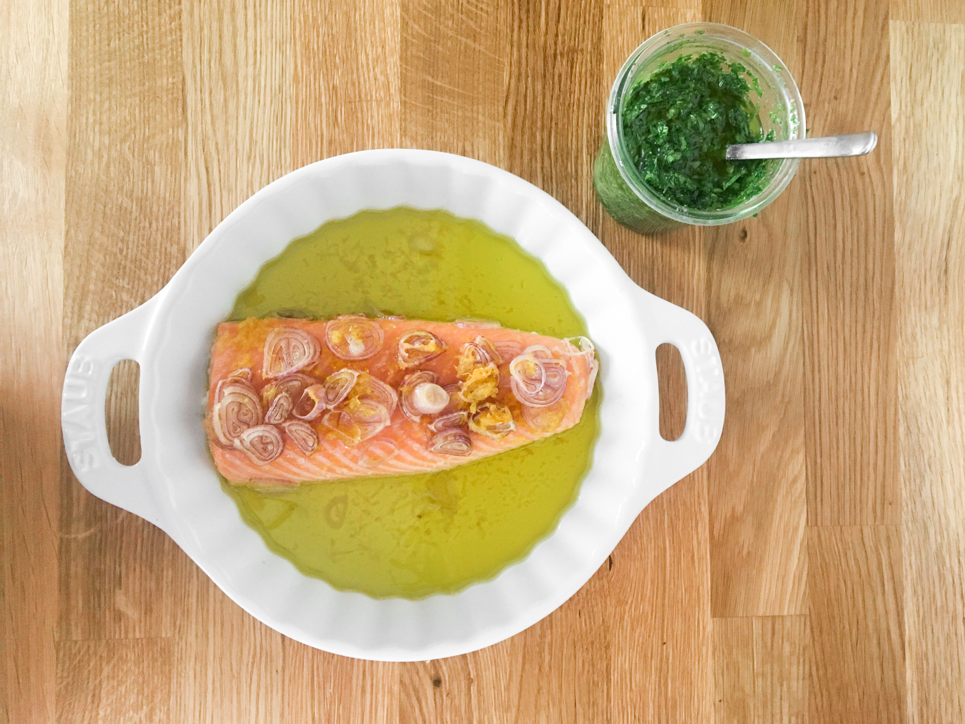 In the meantime, prepare the salsa verde. Halve and juice the lemon. Finely chop the wild garlic, parsley, and mint. Add herbs to a bowl with Dijon mustard, lemon juice, and remaining olive oil. Season with salt and pepper. Serve roasted salmon with wild garlic salsa verde. Enjoy!