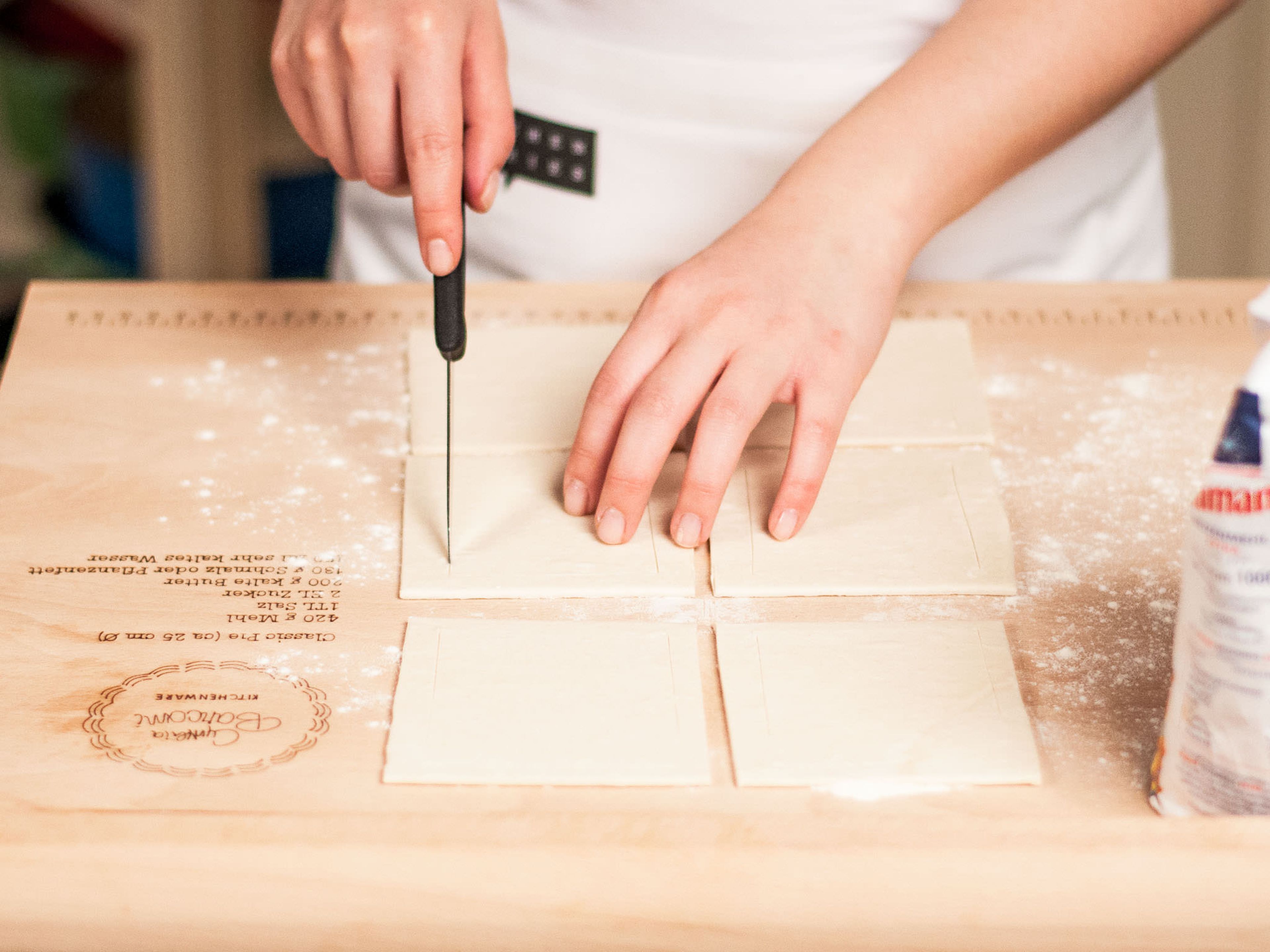 Preheat oven to 180°C/350°F. Cut defrosted puff pastry into 6 cm squares with a sharp knife.