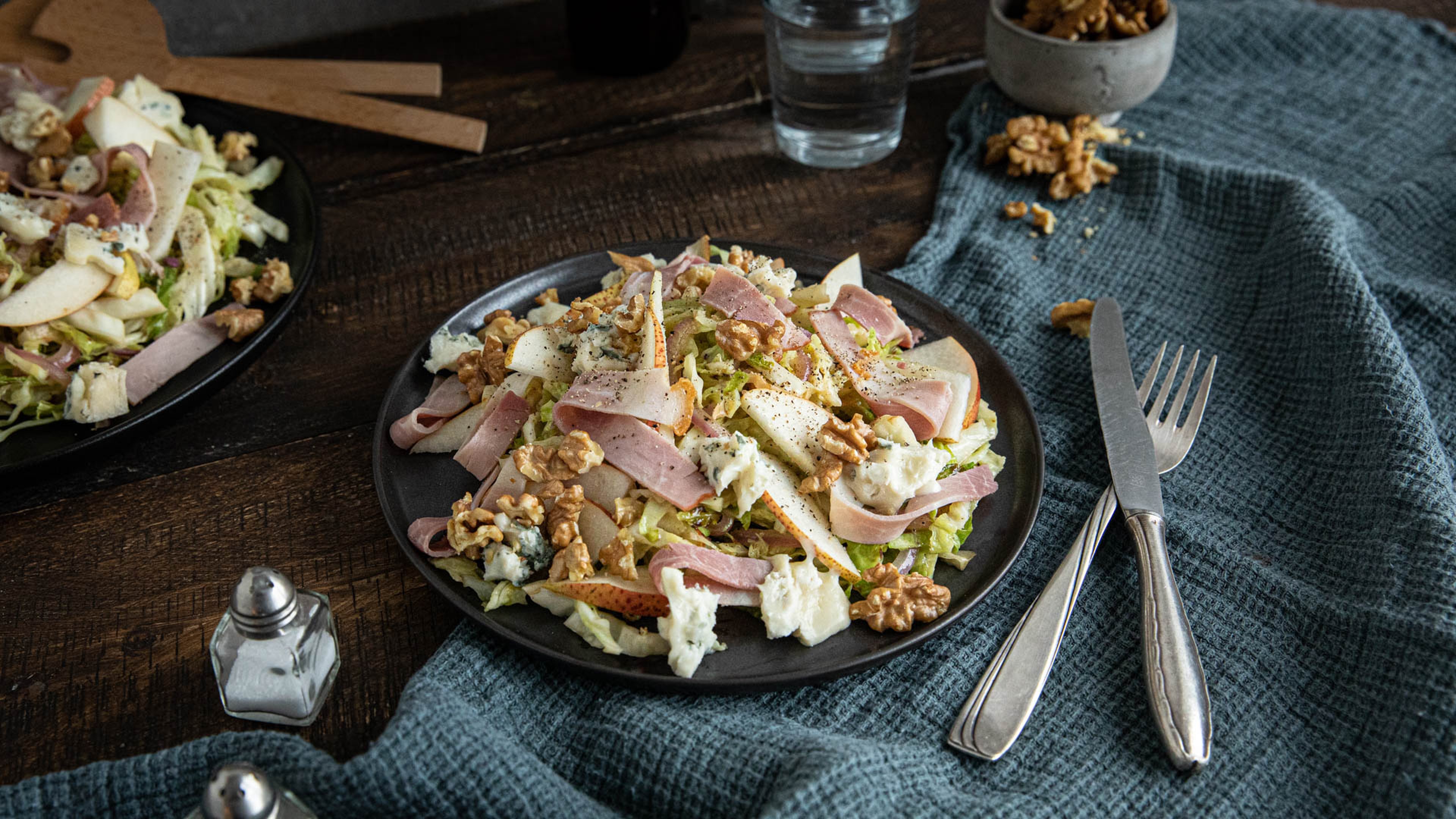 Savoy cabbage salad with pears, walnuts, and ham