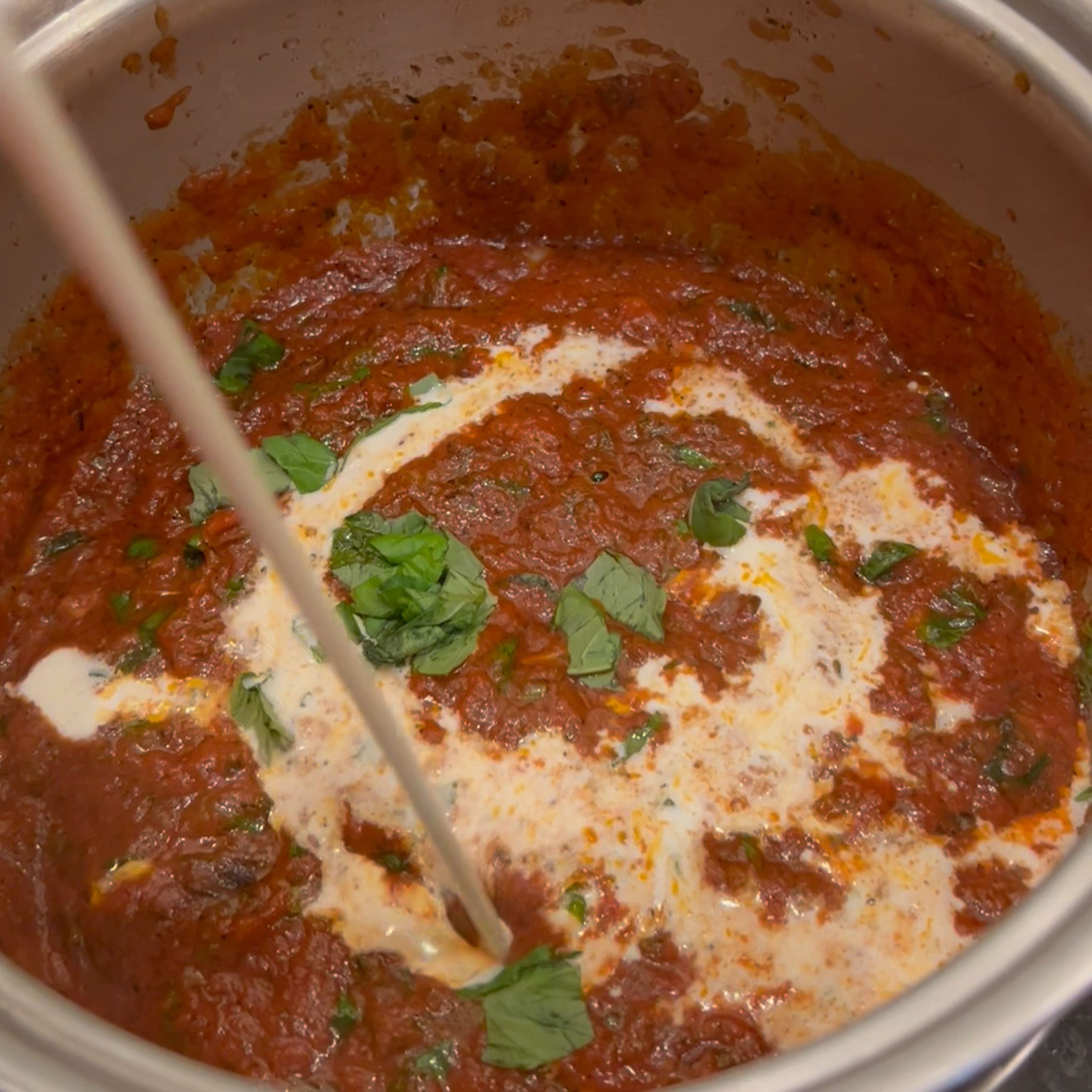 add heavy cream to sauce pan and stir to combine, then heat the sauce to a simmer