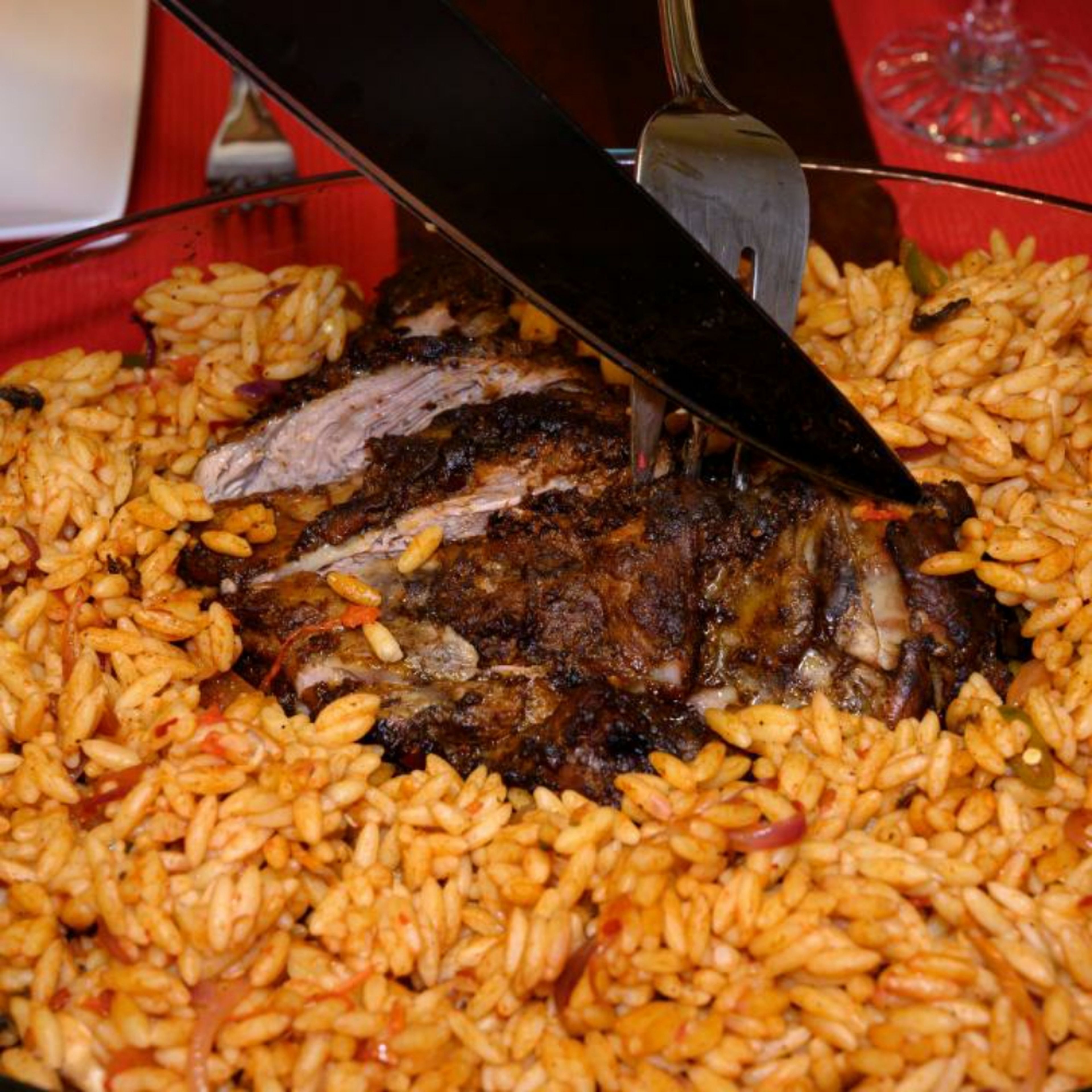 Evenly slice the lamb shoulder and serve with the Orzo pasta.