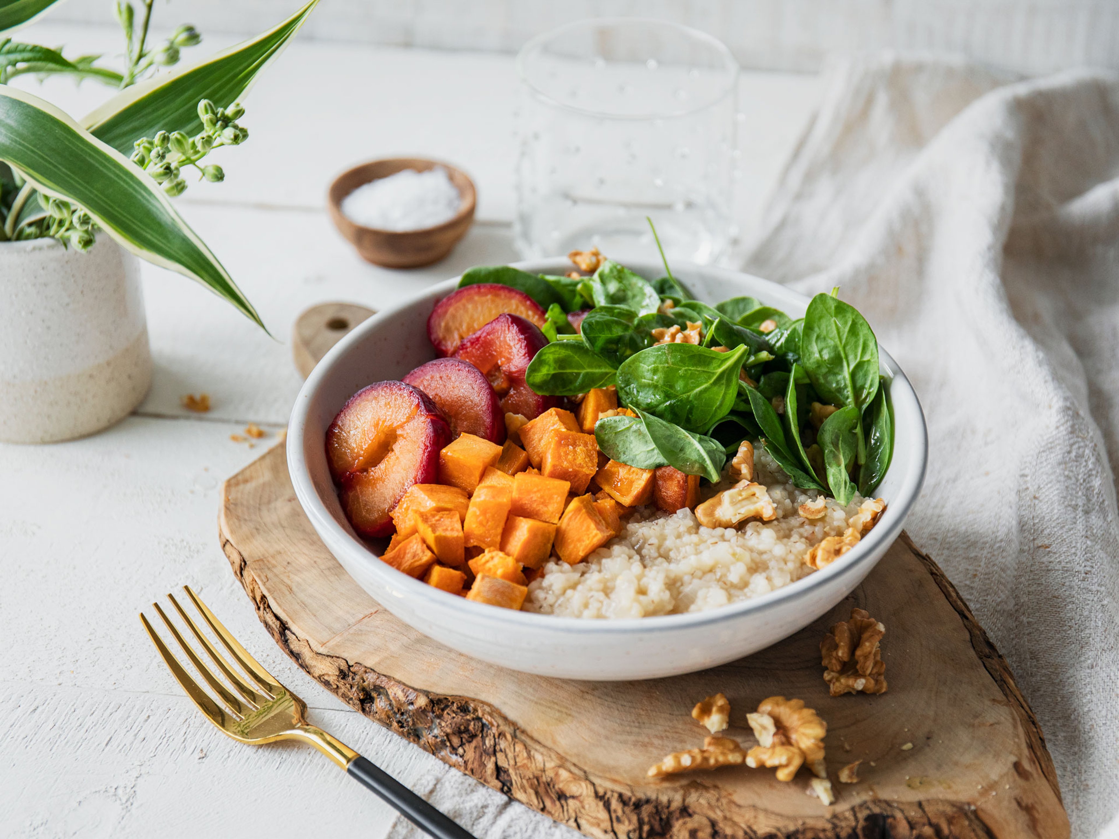 Sweet potato grain bowl with caramelized plums
