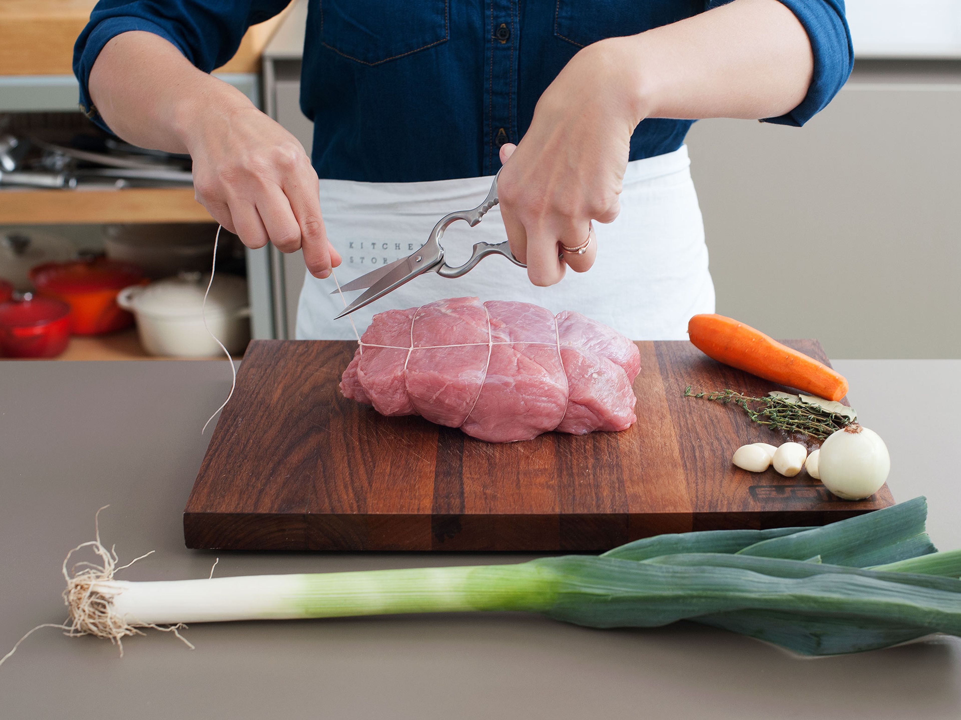 Trim excess fat from the veal and truss it with cooking string. Roughly chop celery, carrot, onion, and leek