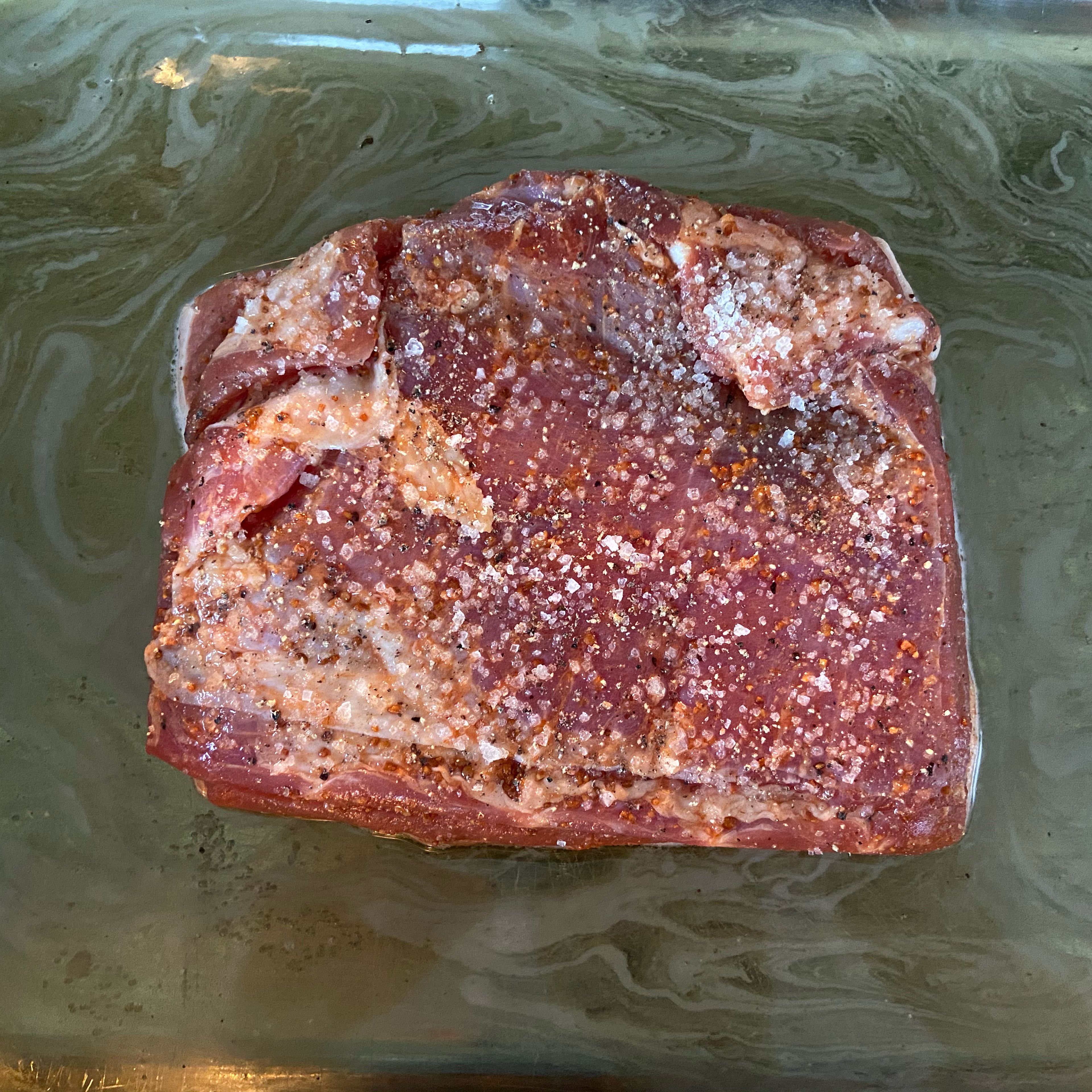 Season the meat, except for the rind. (Salt, pepper, mustard seeds) Place the belly, with the rind facing downwards, in a roasting pan filled, add beer and transfer into the oven for approx. 30 min. at 180°C/360°F top/bottom.
