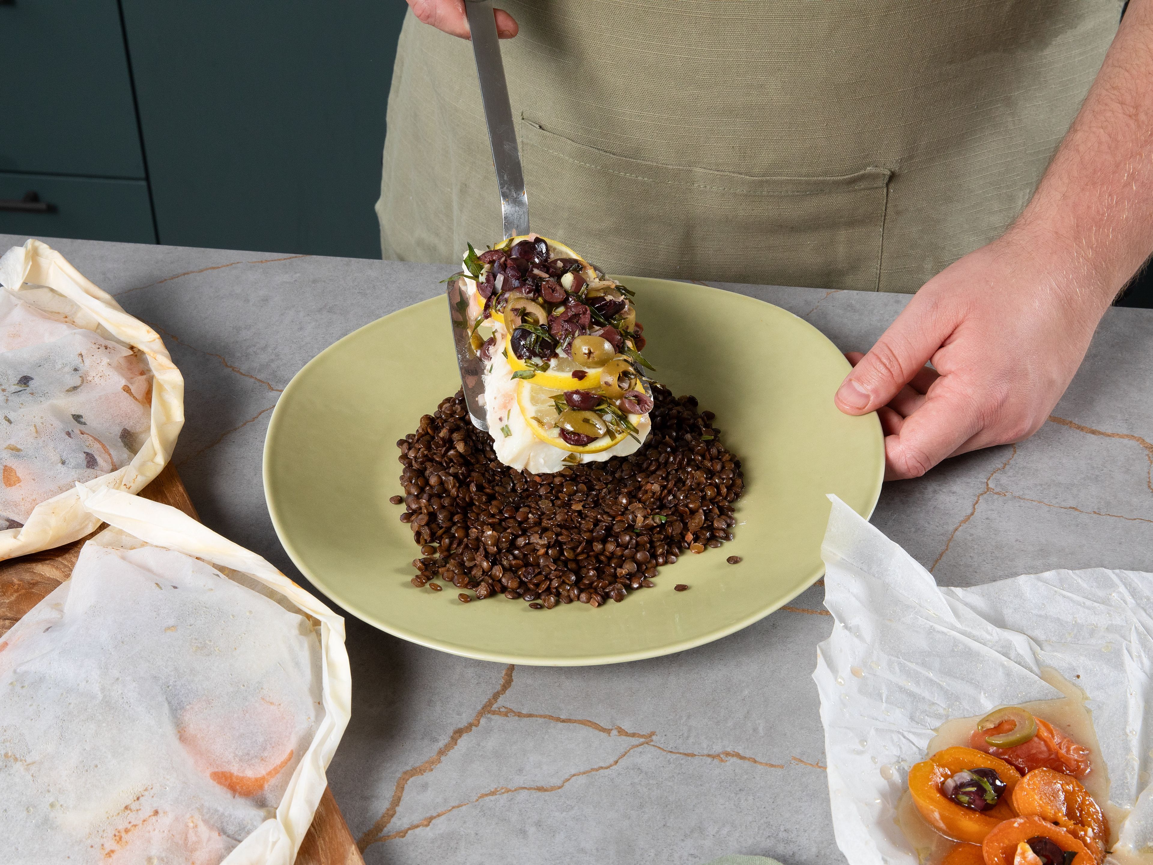 Add packets to preheated oven for approx. 15 min. While fish cooks, add mountain lentils to a pot, add vegetable broth and let simmer according to package instructions. Remove packets from oven and serve on bed of lentils. For serving, top with more fresh tarragon and fresh pepper.