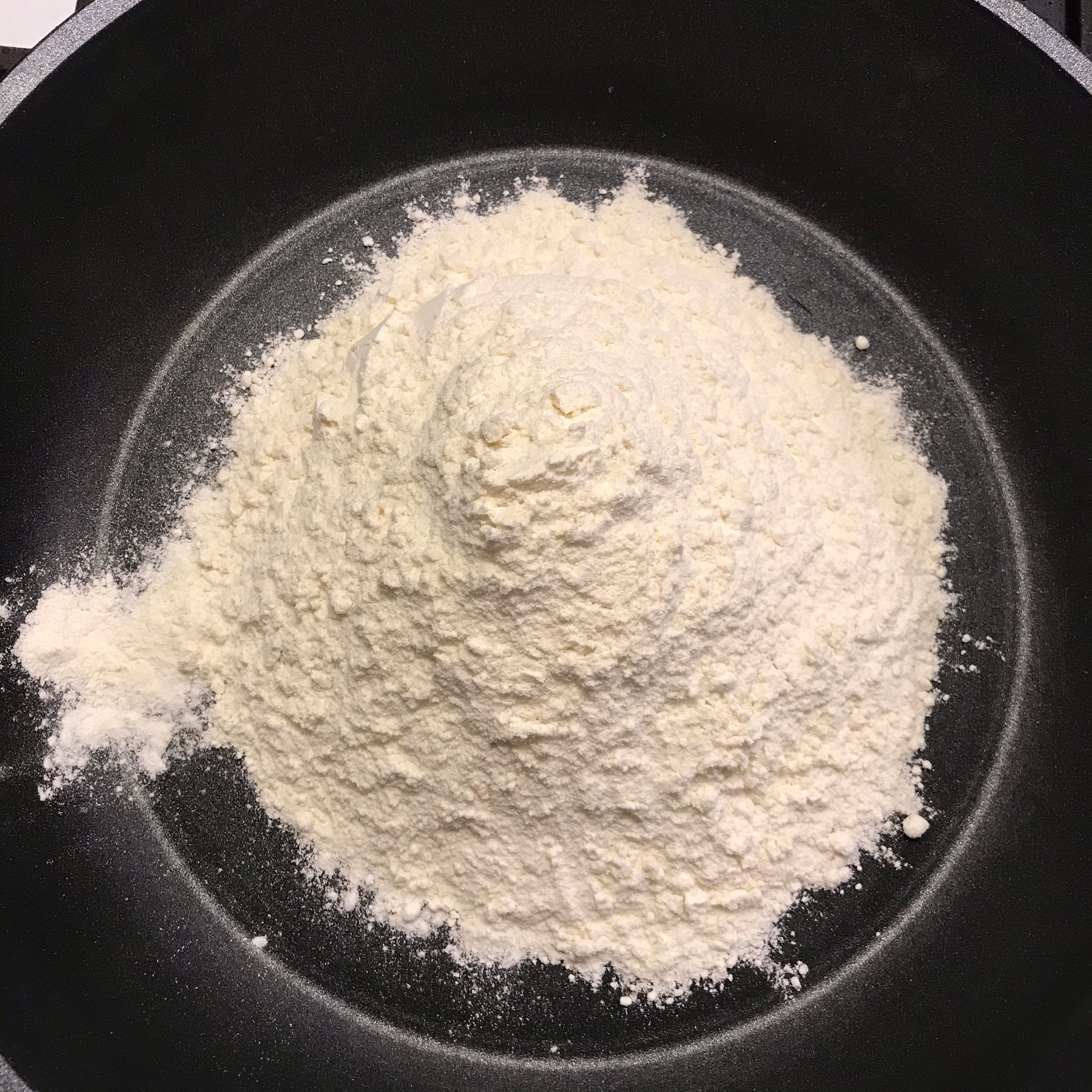 In the meantime, toast the flour in a large pan on stove on medium heat.