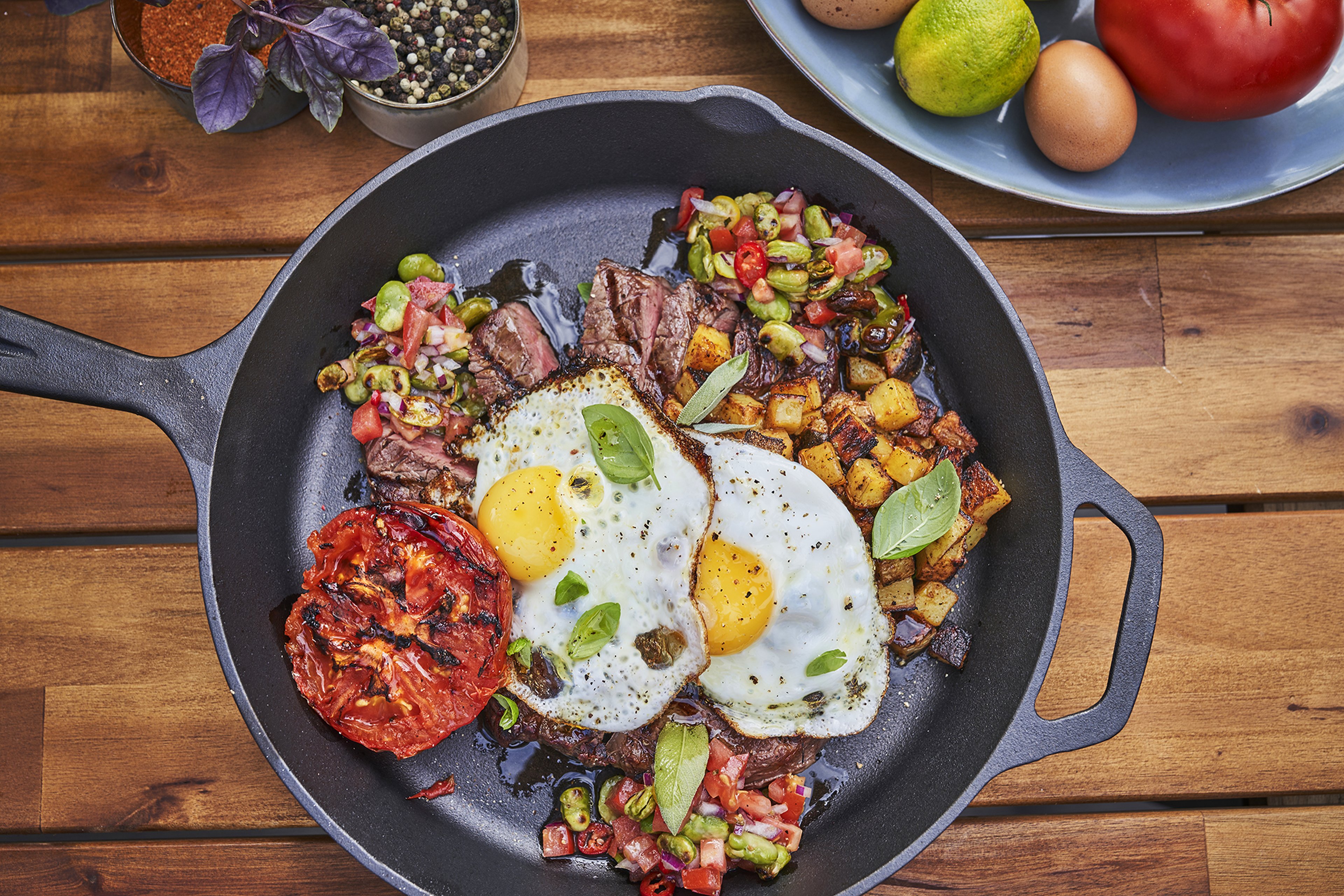 Steak with fried eggs from the griddle