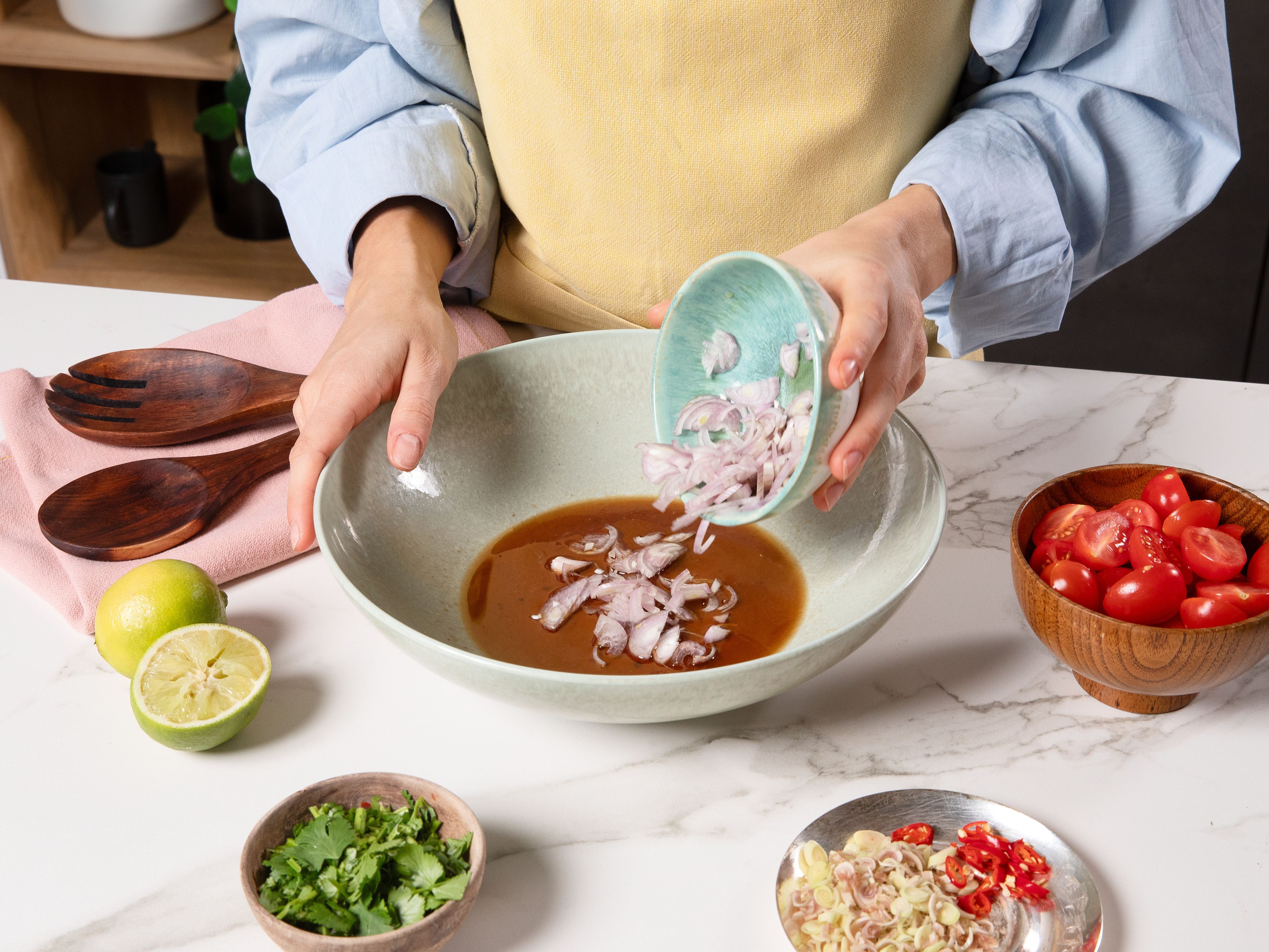 In a big bowl whisk together palm sugar, lime juice and fish sauce until the sugar has completely dissolved. Add the lemongrass, shallot, chili, garlic, tomato, celery and coriander and toss well so everything is evenly coated in the dressing.