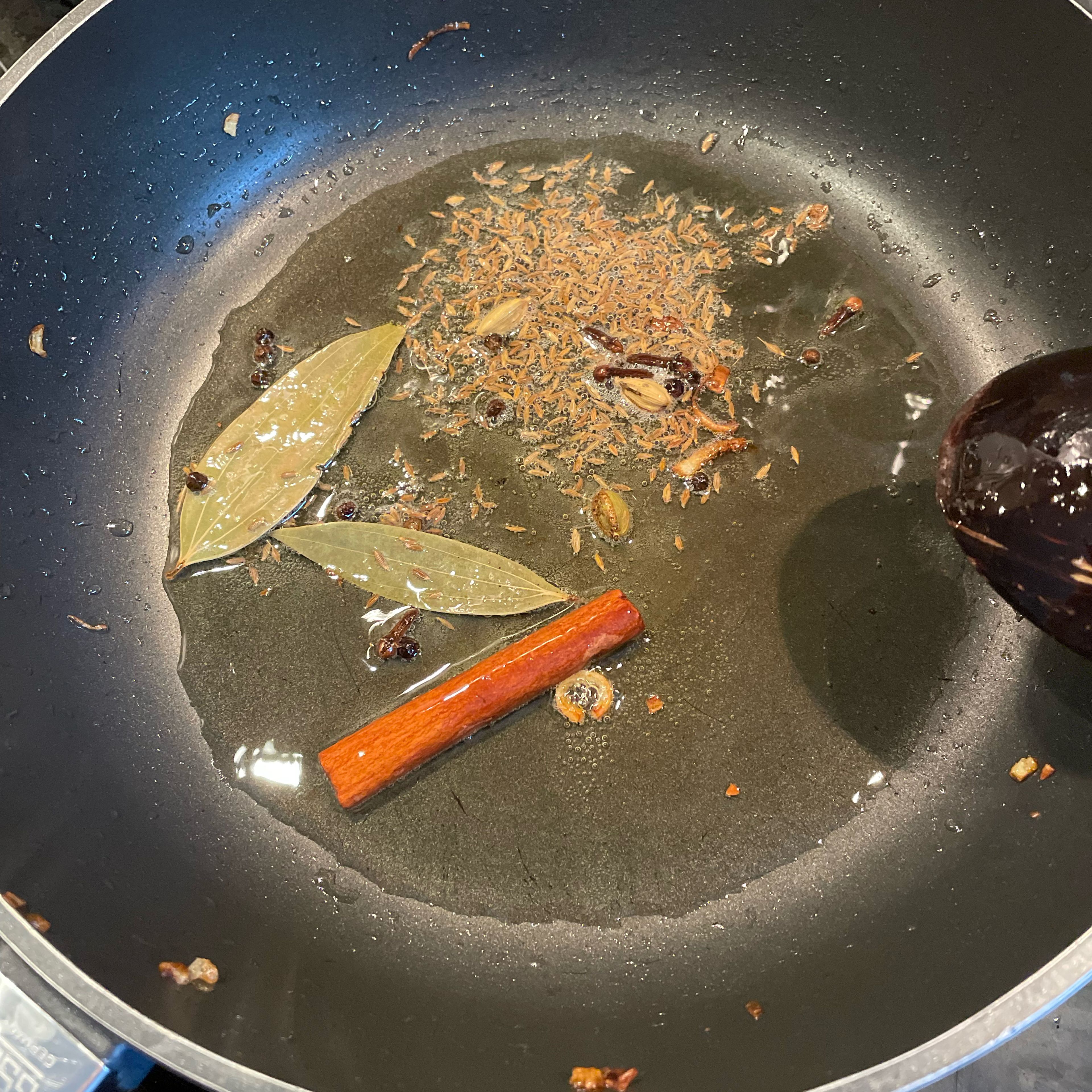 Add ghee to the pan used for the onions earlier. Briefly sautée the whole spices, just 30 seconds.