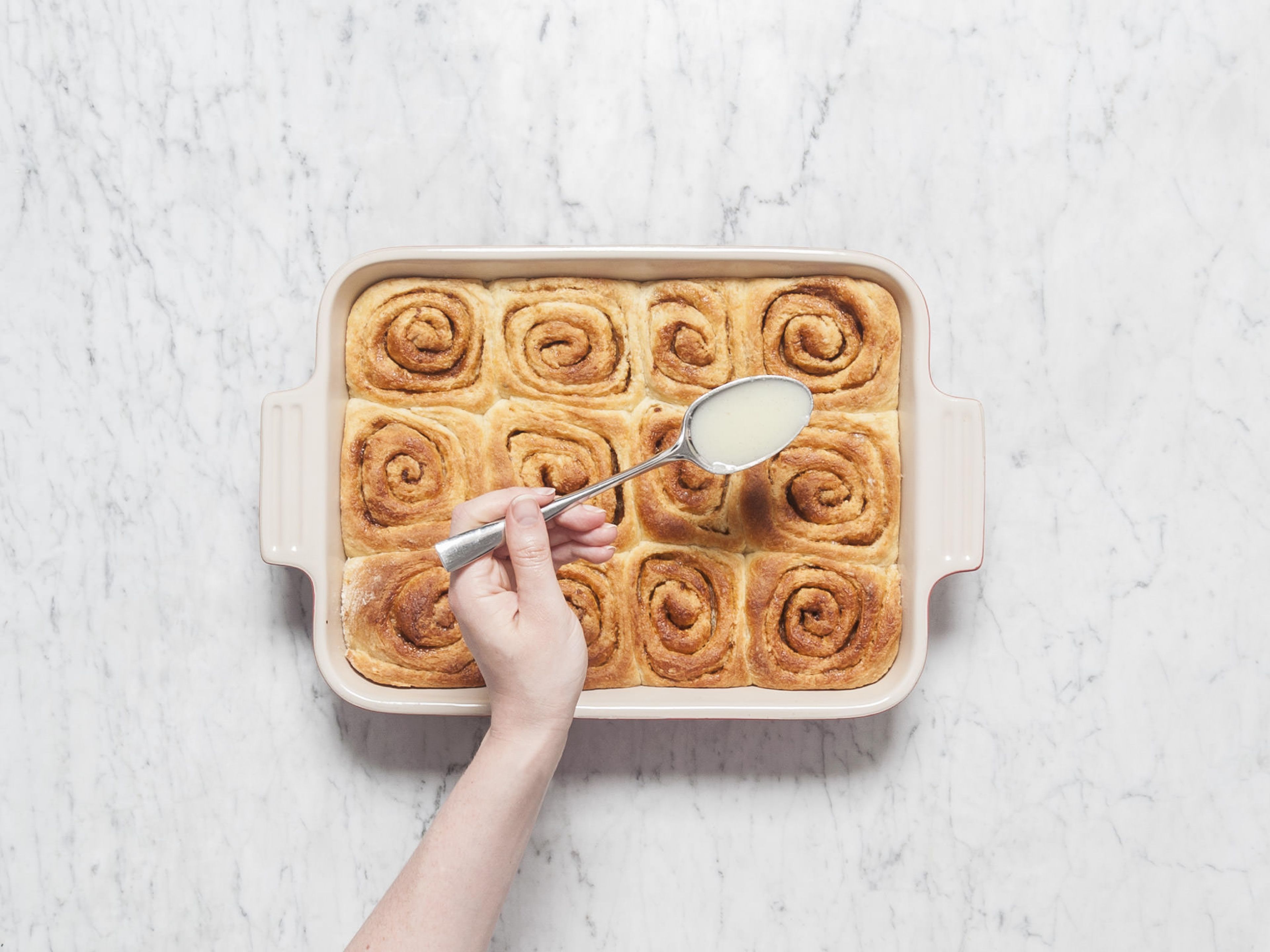 In the meantime, add confectioner’s sugar, remaining milk, remaining vanilla bean seeds, remaining salt, and cream cheese to a small mixing bowl and stir to combine. Drizzle over lukewarm cinnamon buns and enjoy!